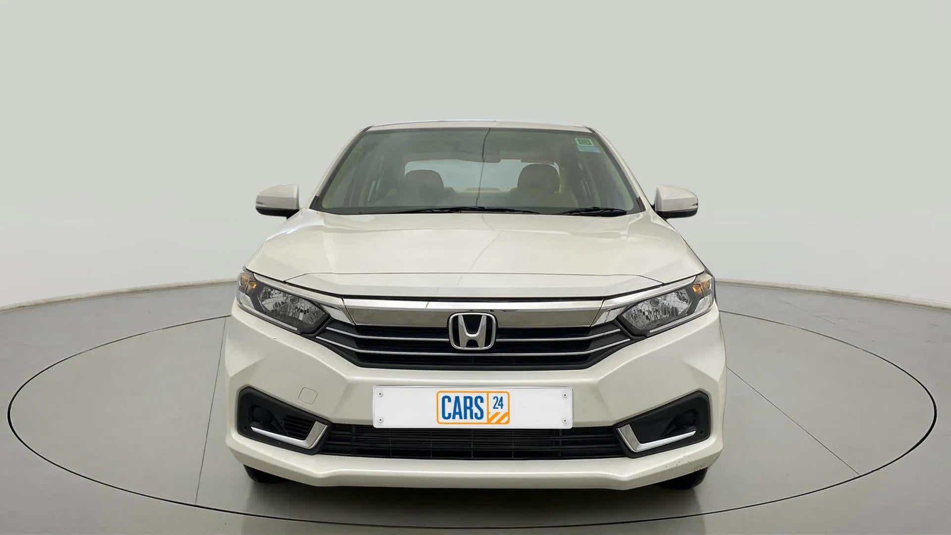 Front view of a platinum white pearl Honda Amaze