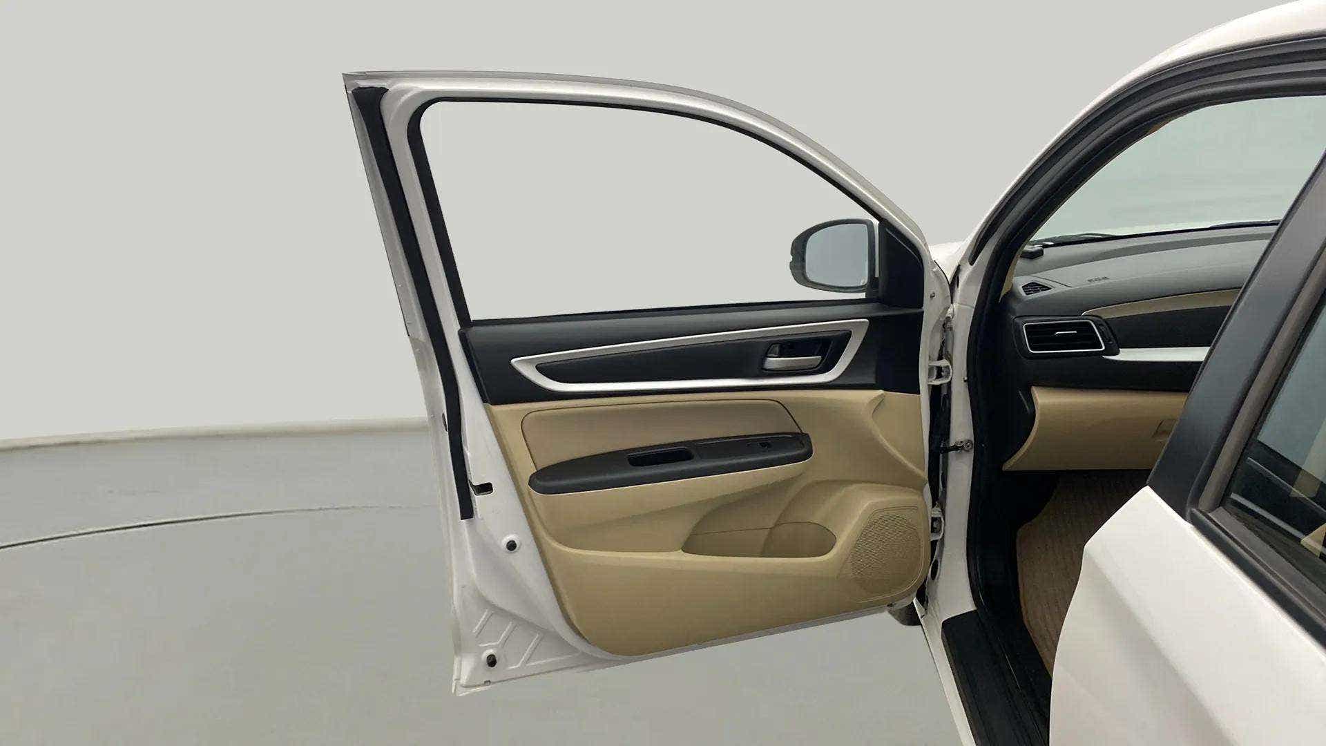 Front driver side door and dashboard of a Honda Amaze