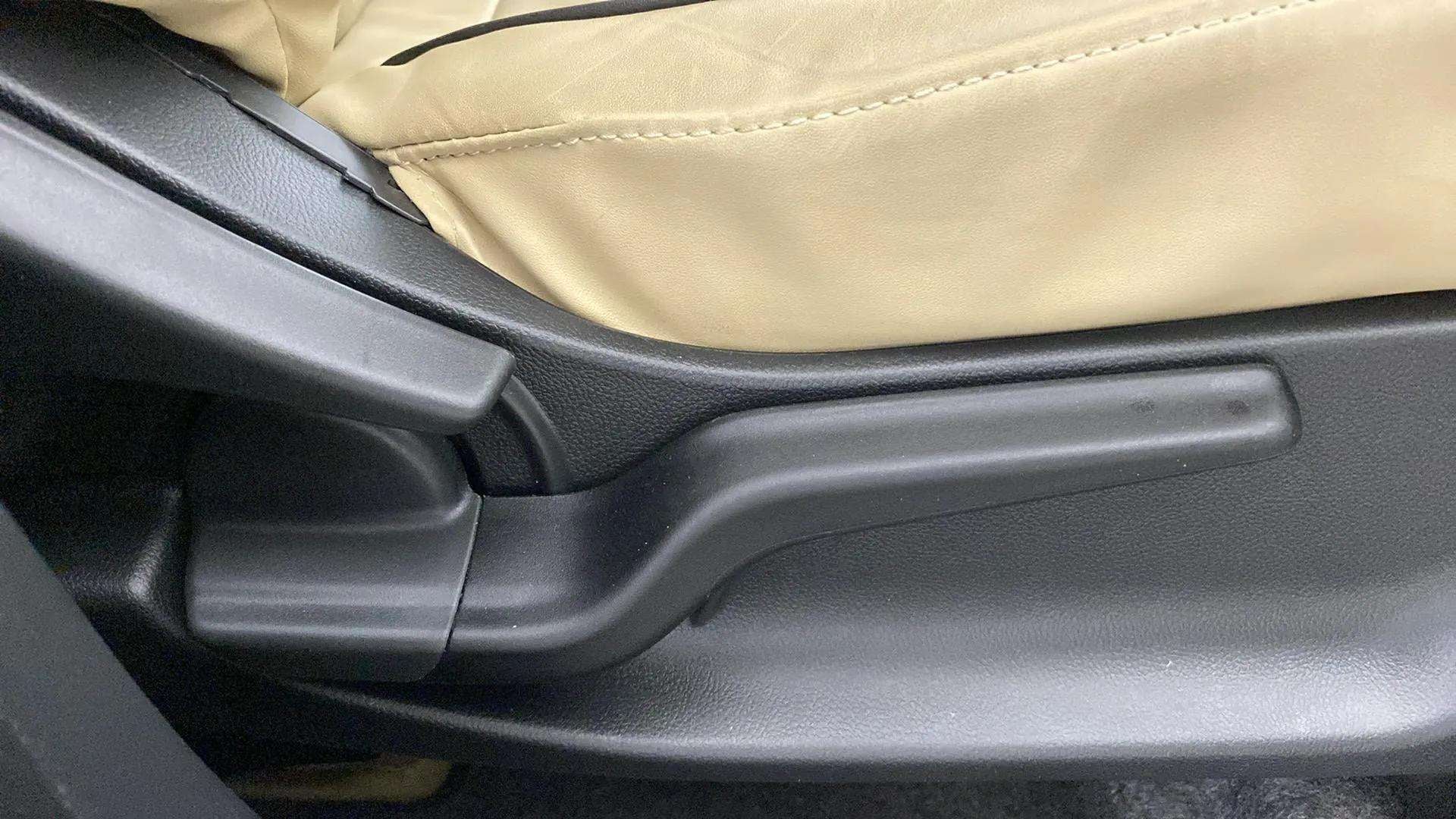 Side view of the front seat adjustment lever of a Honda Amaze