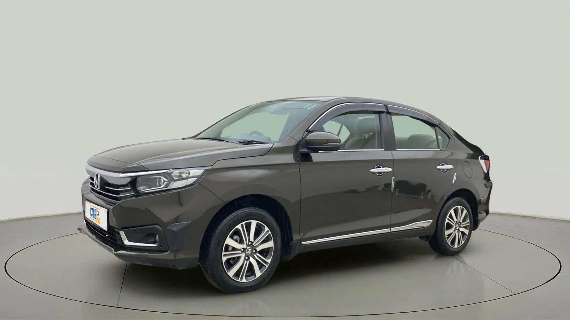 Front three-quarter view of a meteoroid grey metallic Honda Amaze