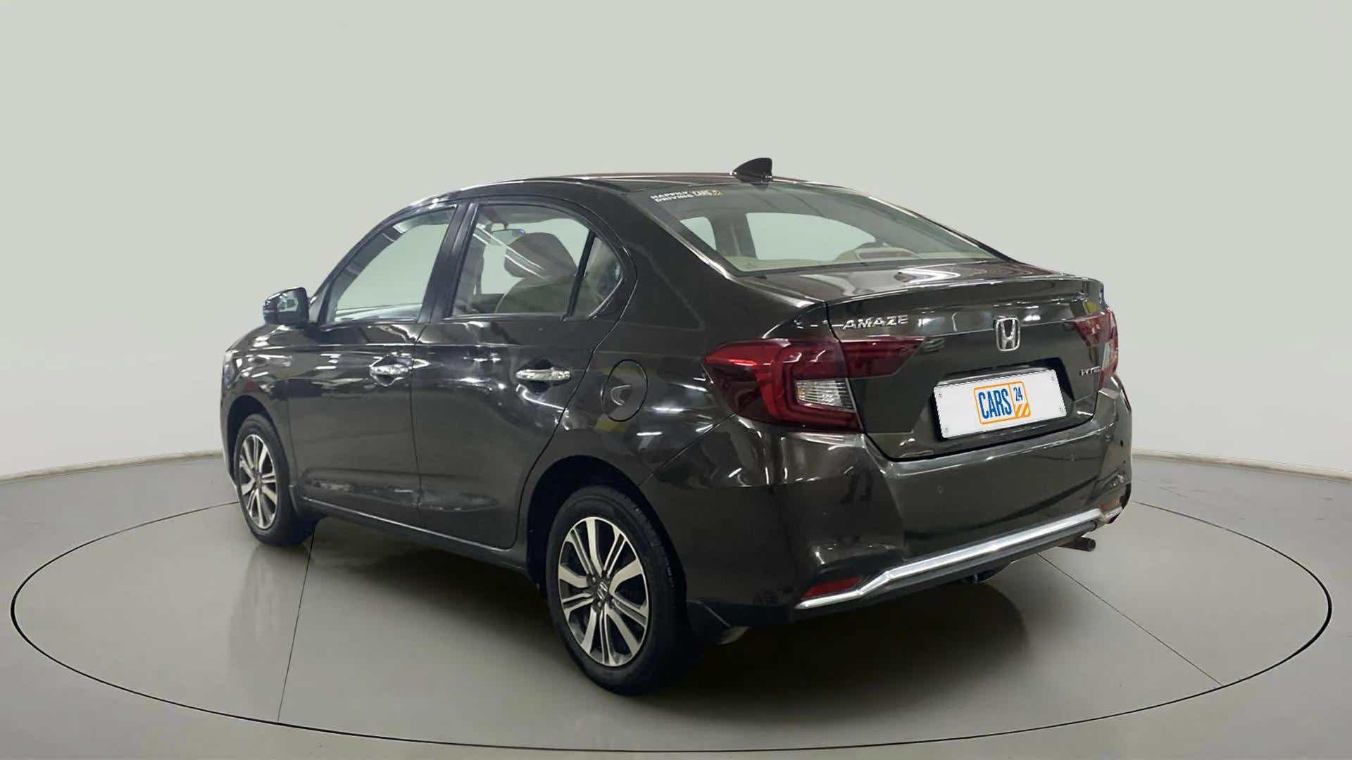 Rear three-quarter view of a meteoroid grey metallic Honda Amaze
