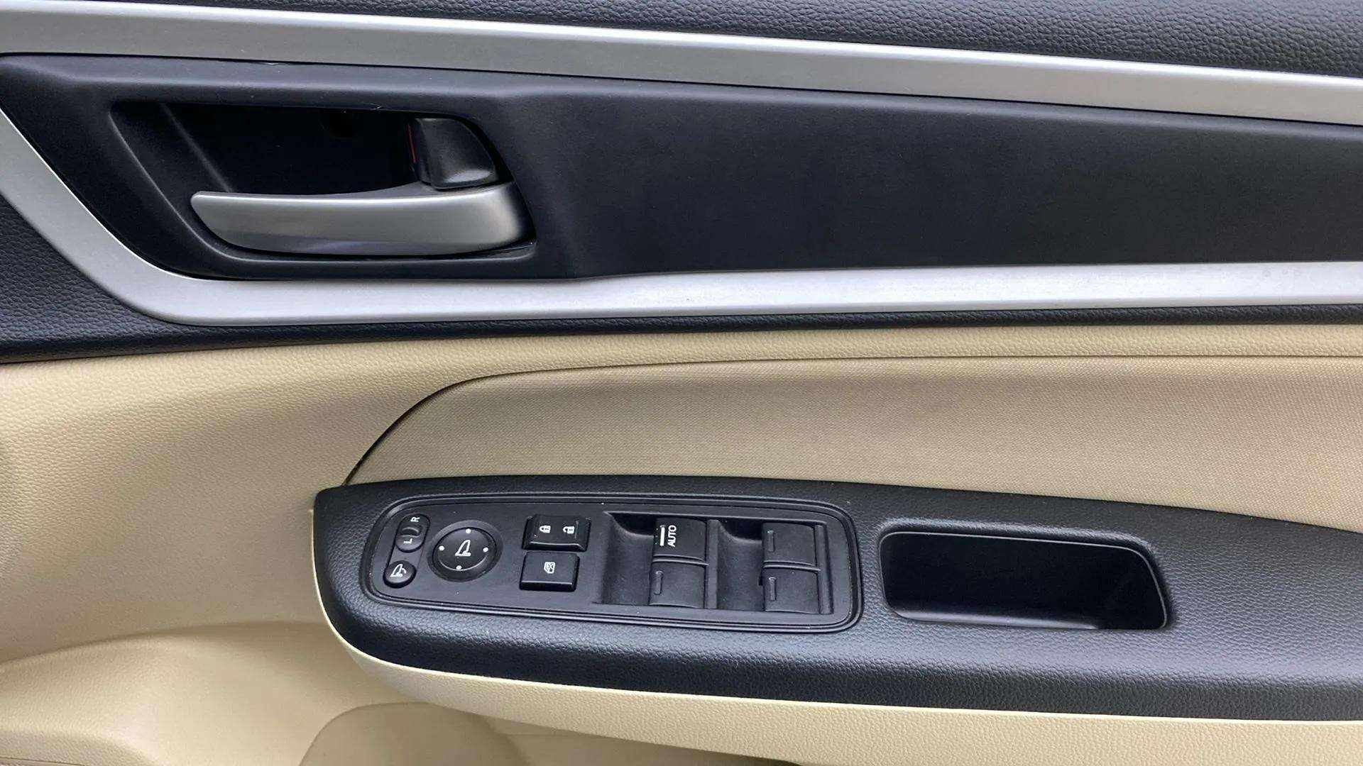 Driver side door controls of a Honda Amaze