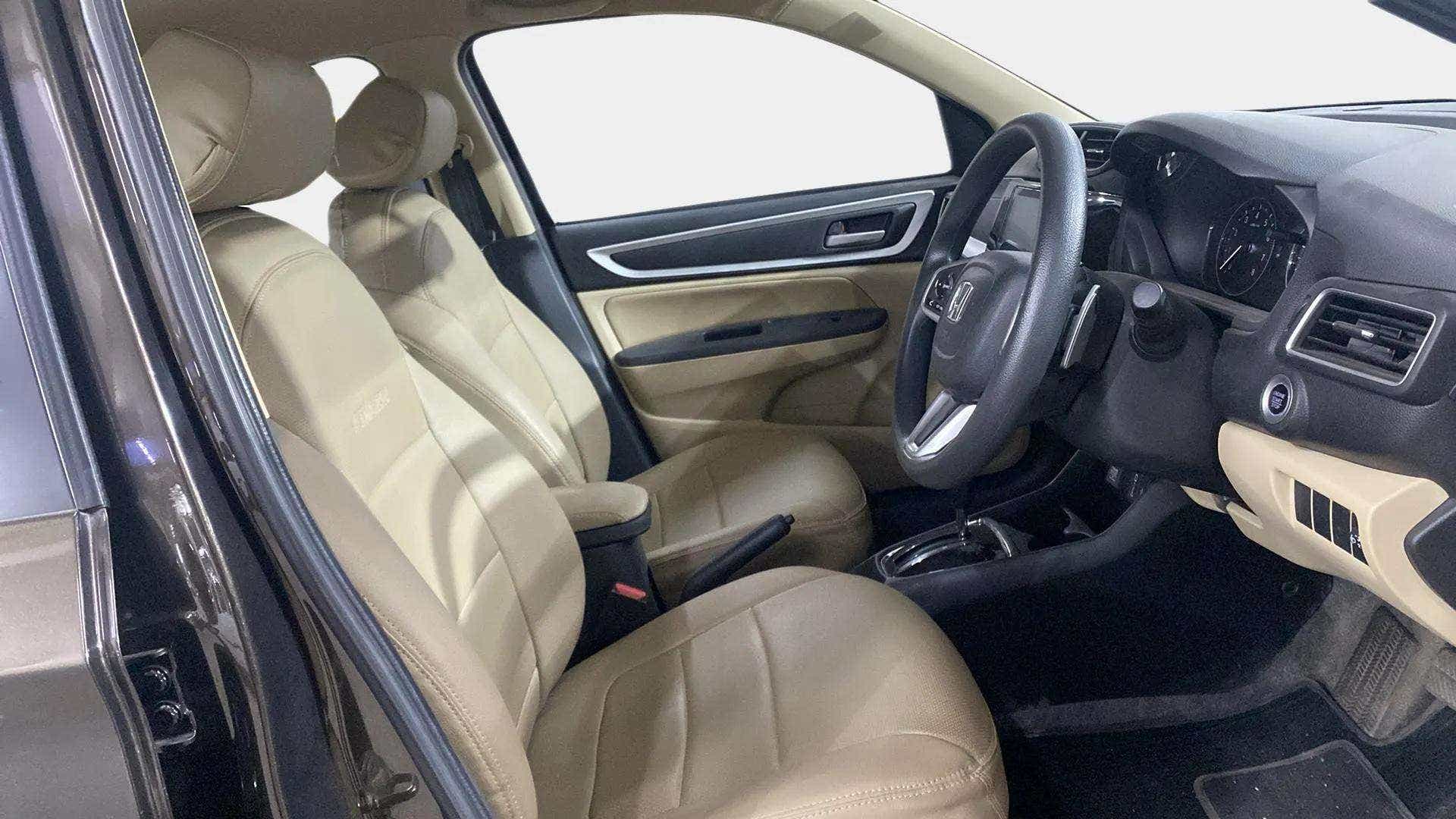 Interior front seats and dashboard of a Honda Amaze