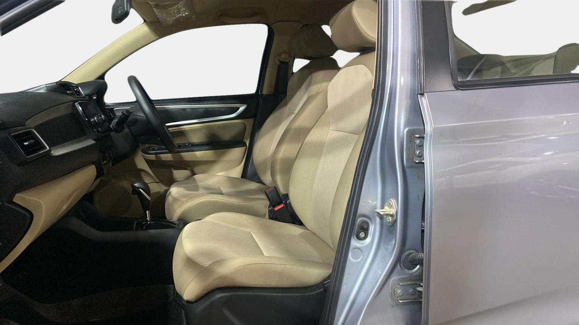 Interior front seats and dashboard of a Honda Amaze