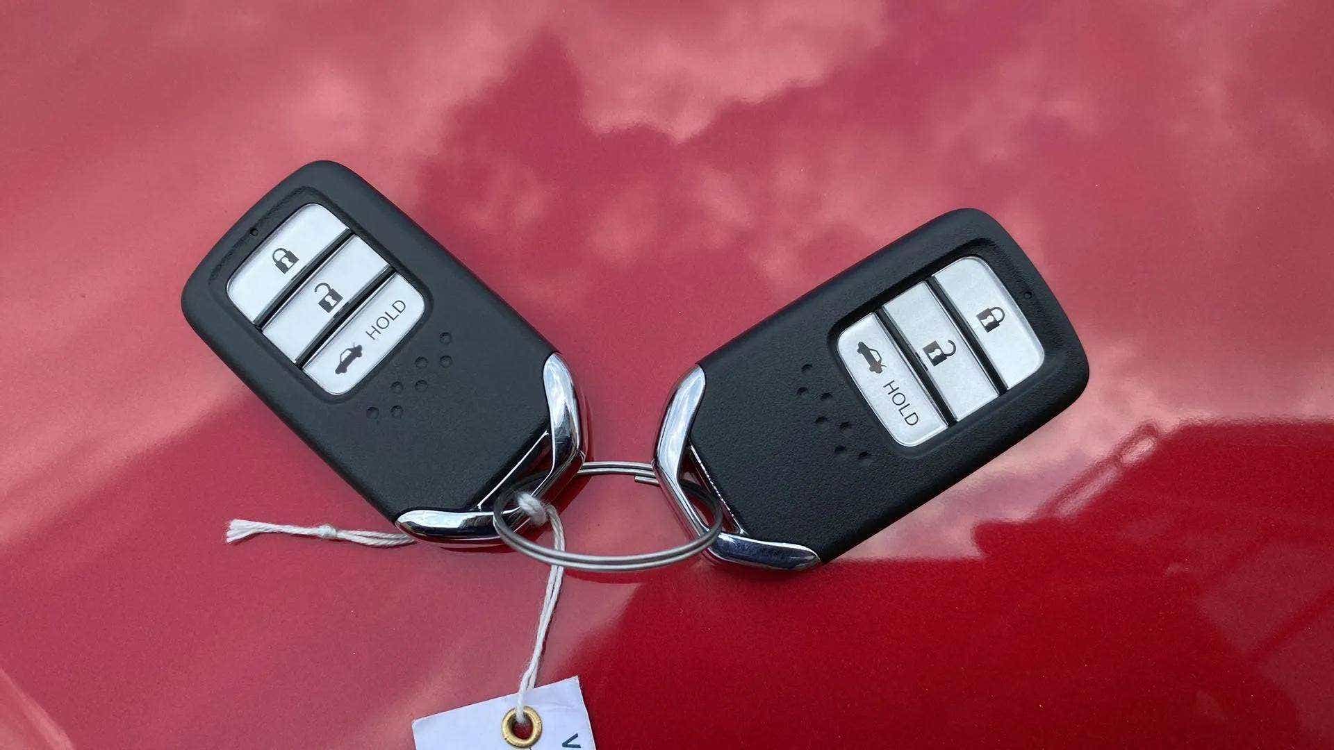 Honda Amaze key fobs on a car exterior