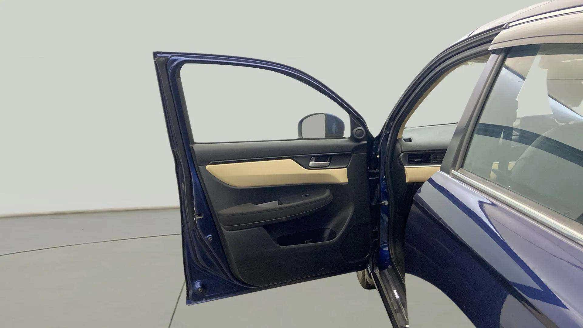 Open front door view of a Honda Amaze