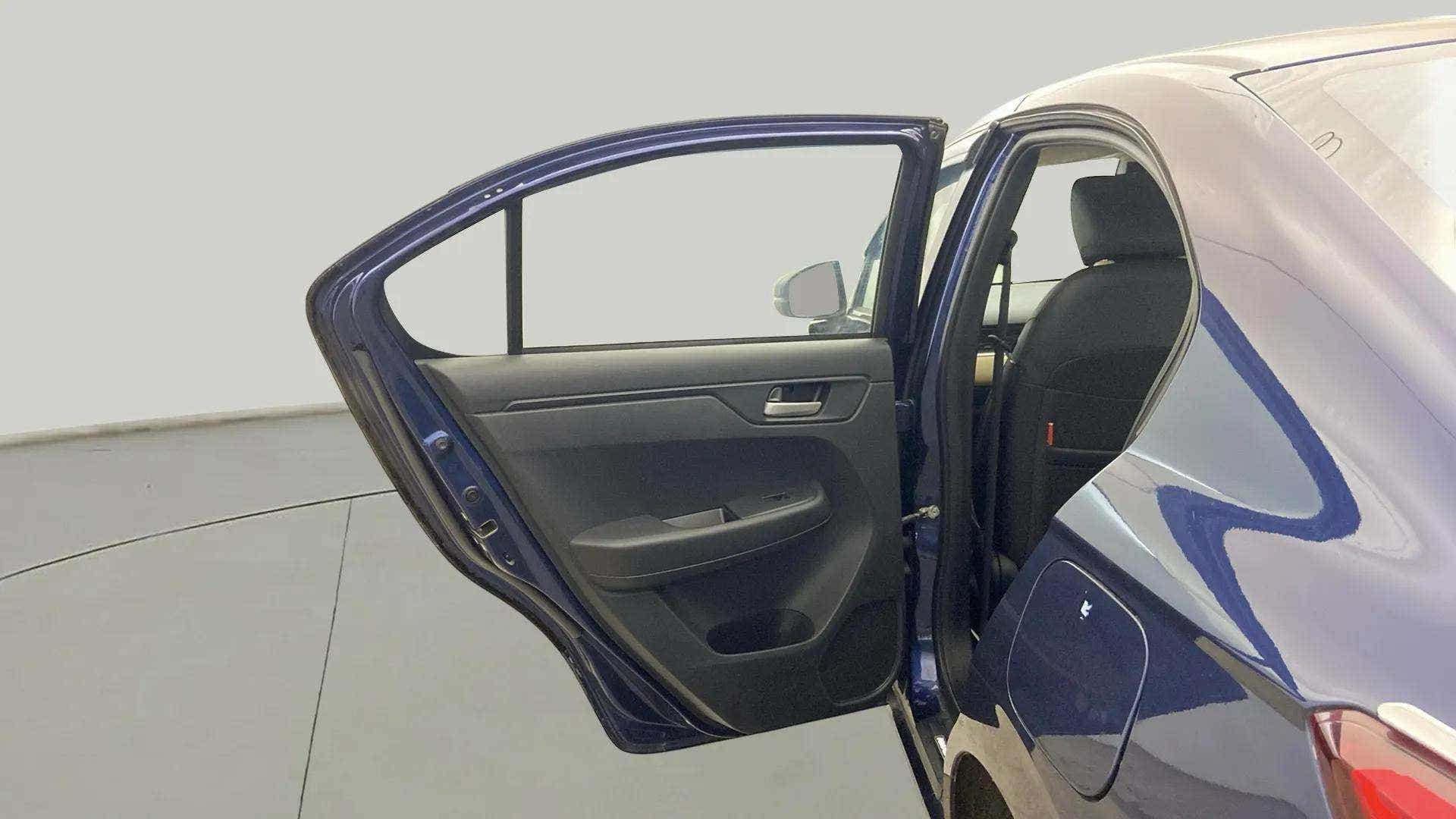 Rear left door open view of a Honda Amaze