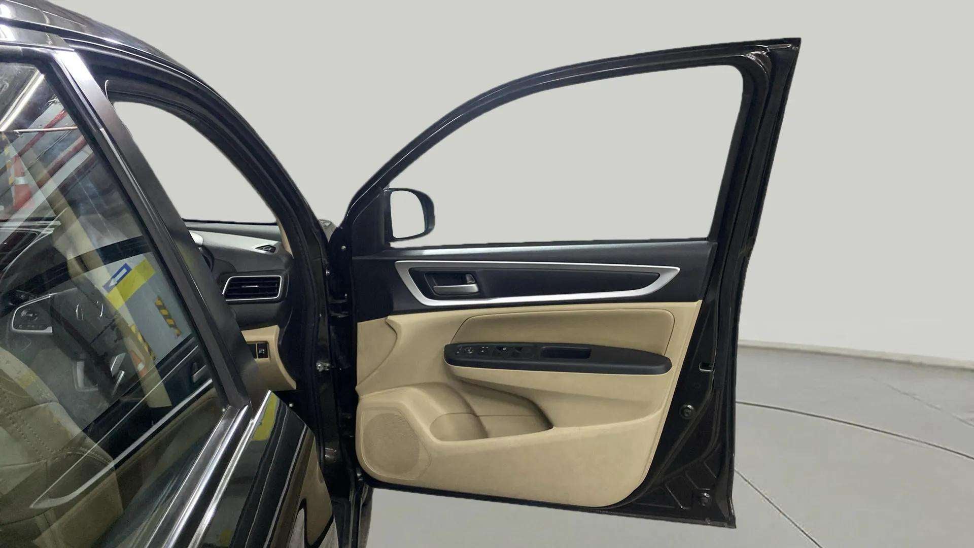 Interior driver door panel of a Honda Amaze