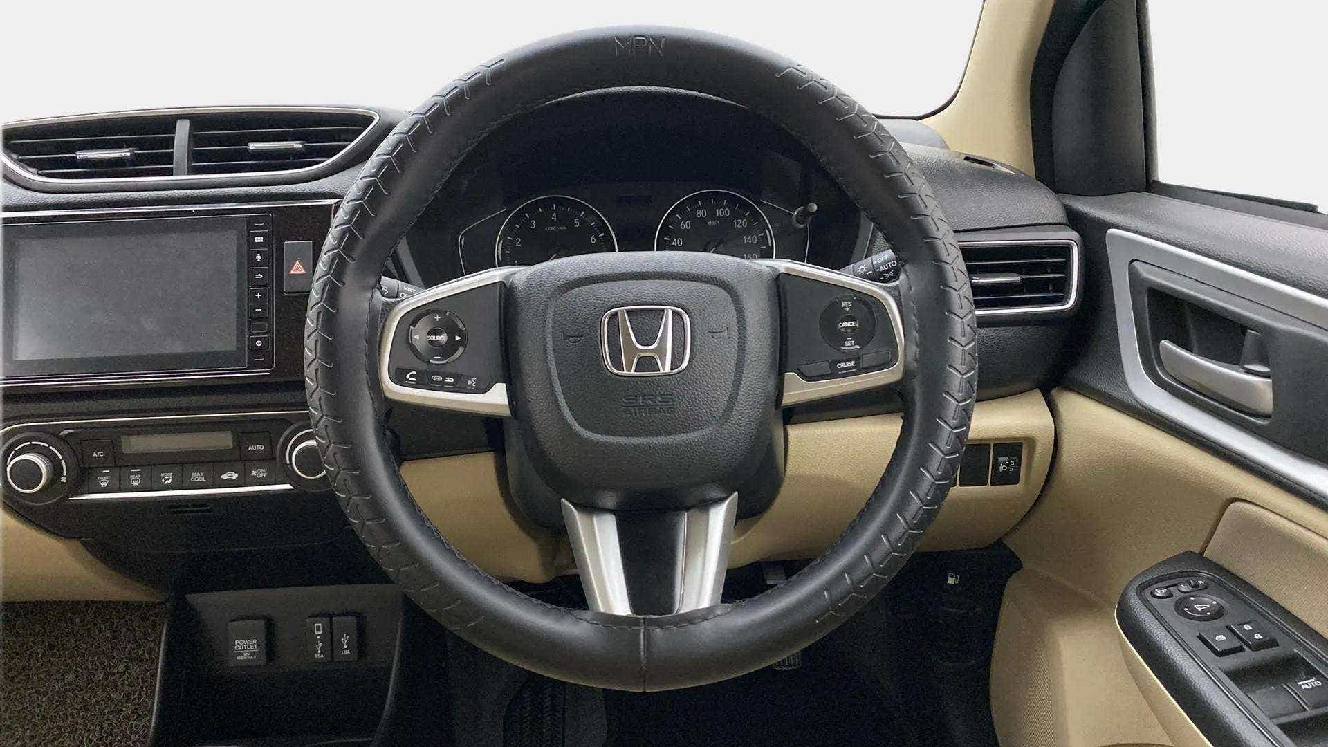 Interior dashboard and steering wheel of a Honda Amaze