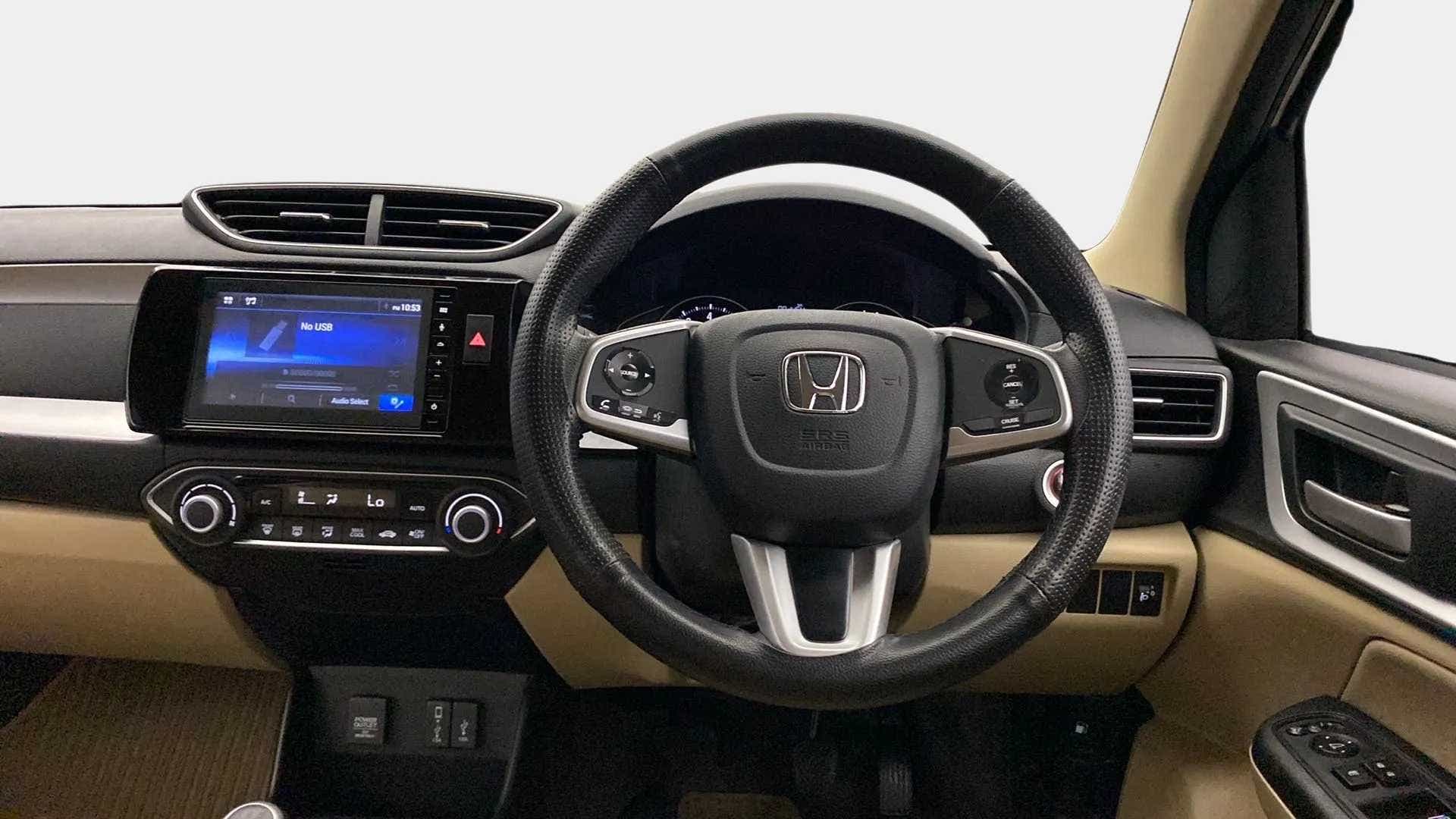 Dashboard and steering wheel view of a Honda Amaze