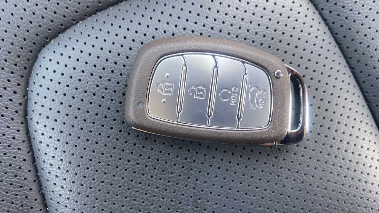 Car key fob on leather seat of a Hyundai Creta 2018-2023