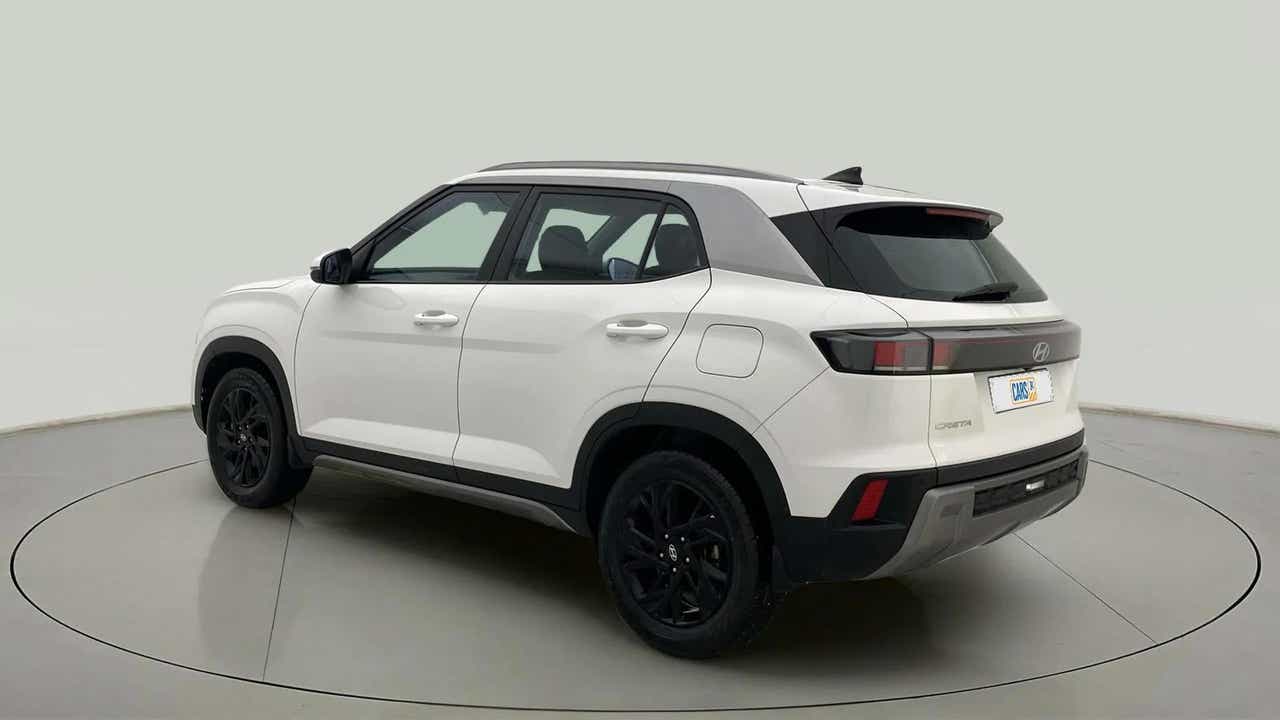 Rear three-quarter of a atlas white with abyss black Hyundai Creta