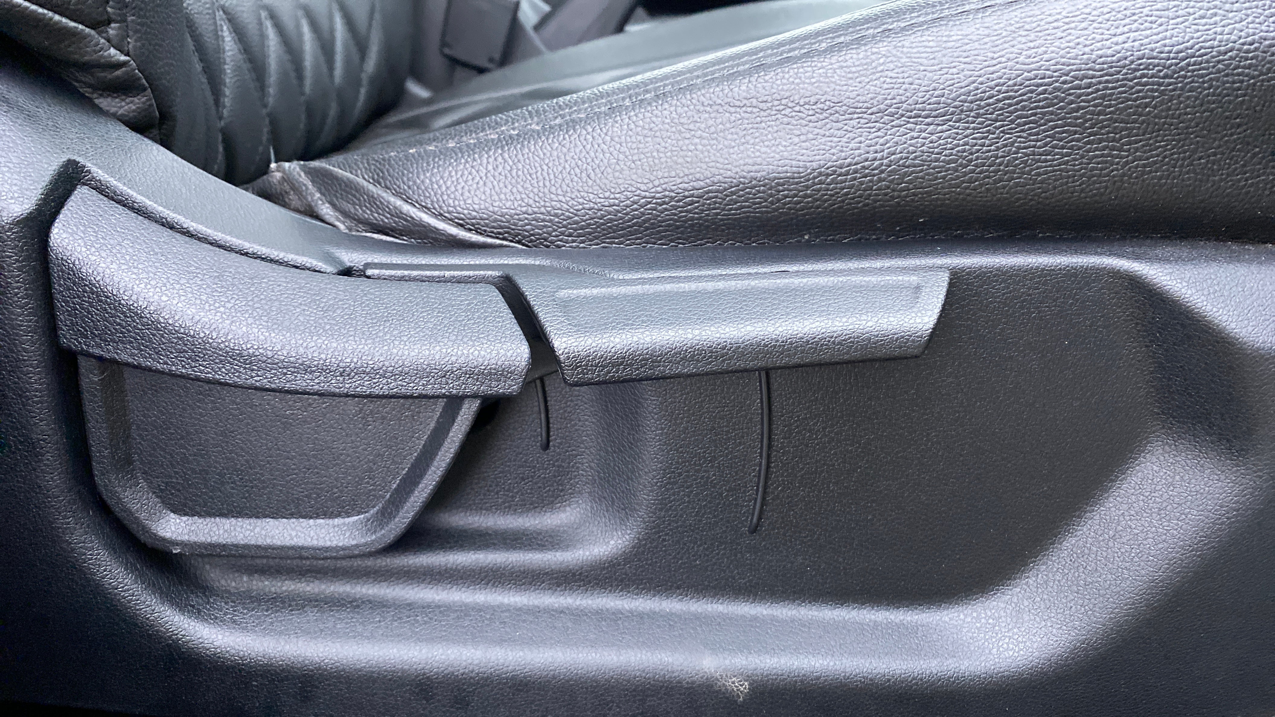Close-up view of a seat adjustment lever in a Hyundai Creta 2018-2023