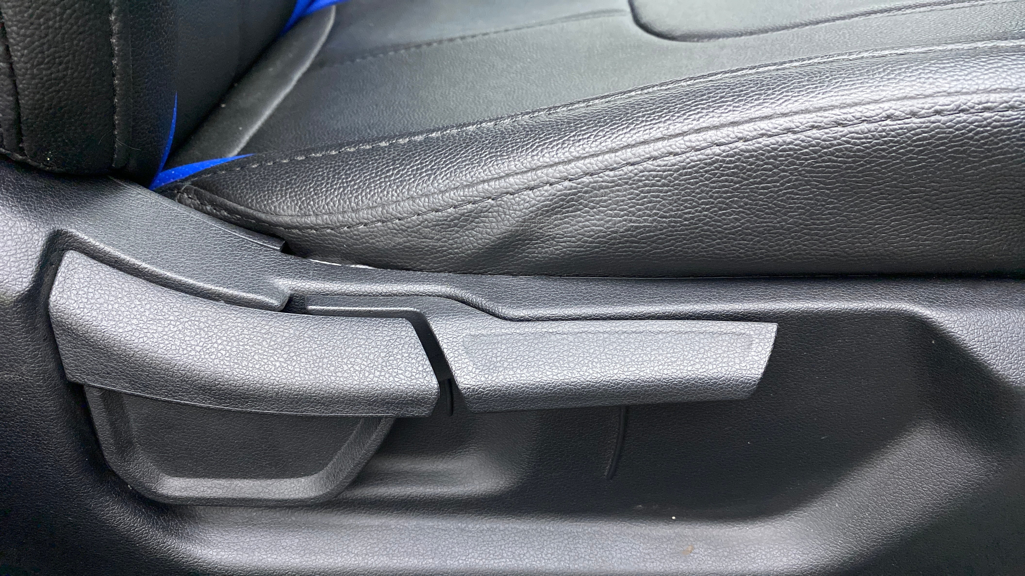 Close-up of a seat adjustment lever in a Hyundai Creta 2018-2023
