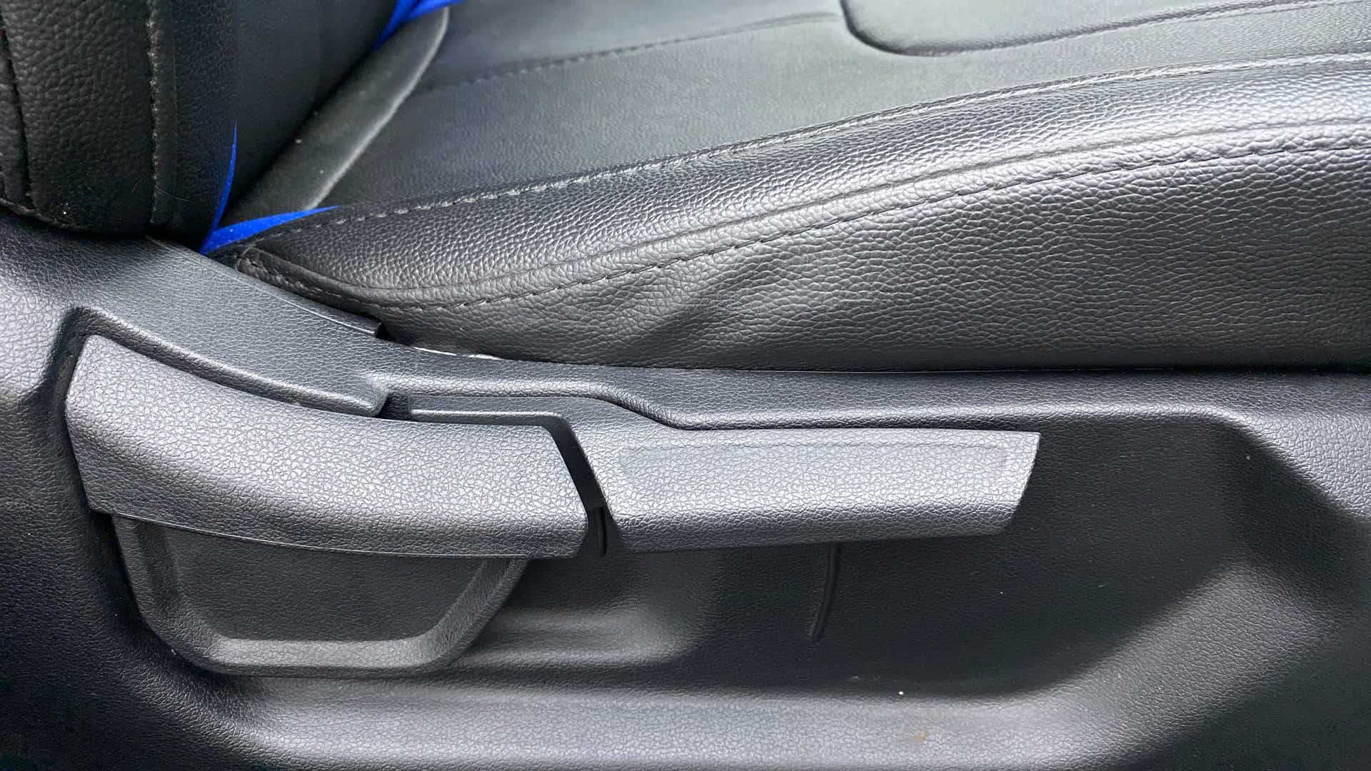 Close-up of a seat adjustment lever in a Hyundai Creta 2018-2023