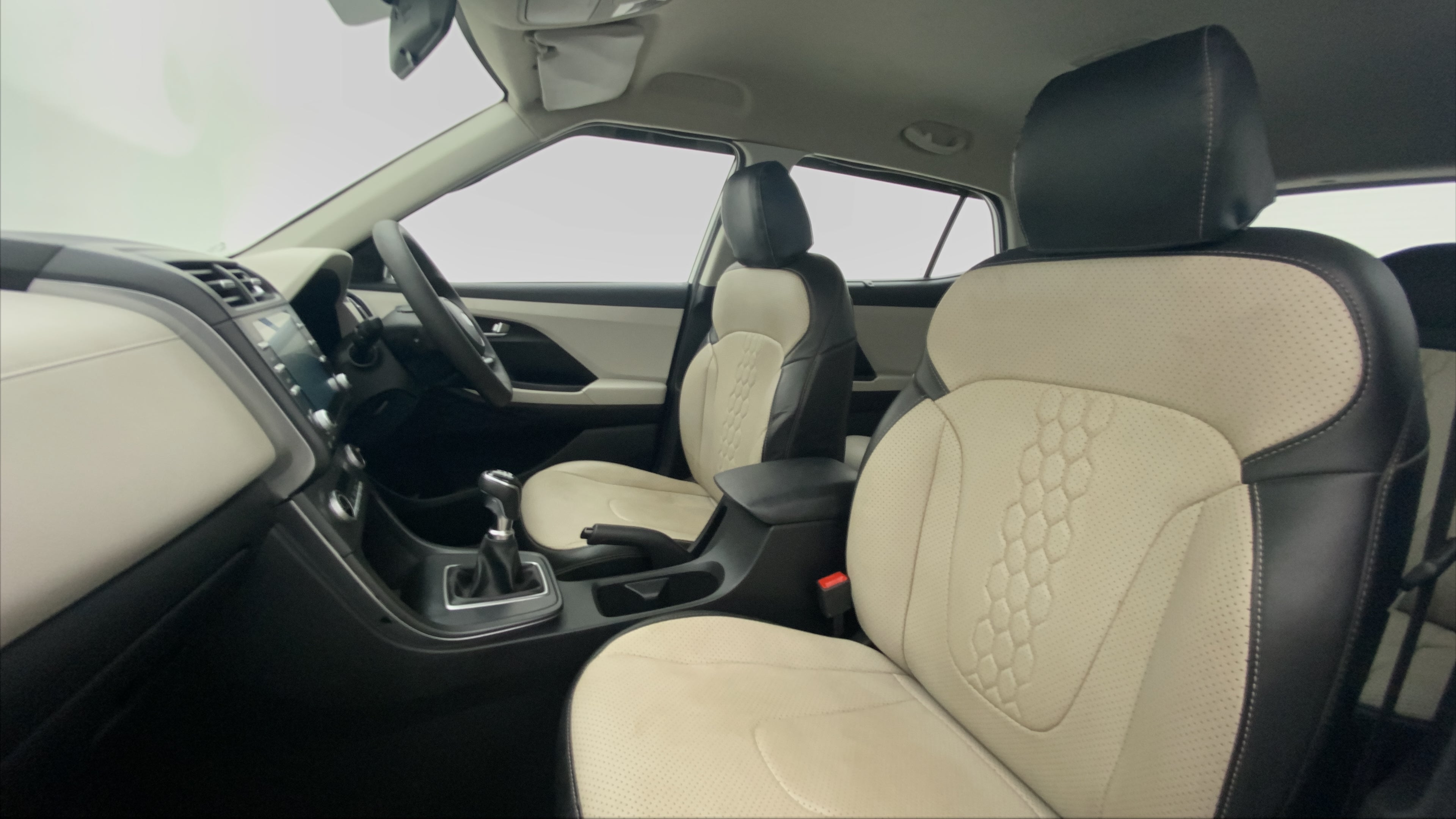 Front seats and dashboard view of a Hyundai Creta 2018-2023