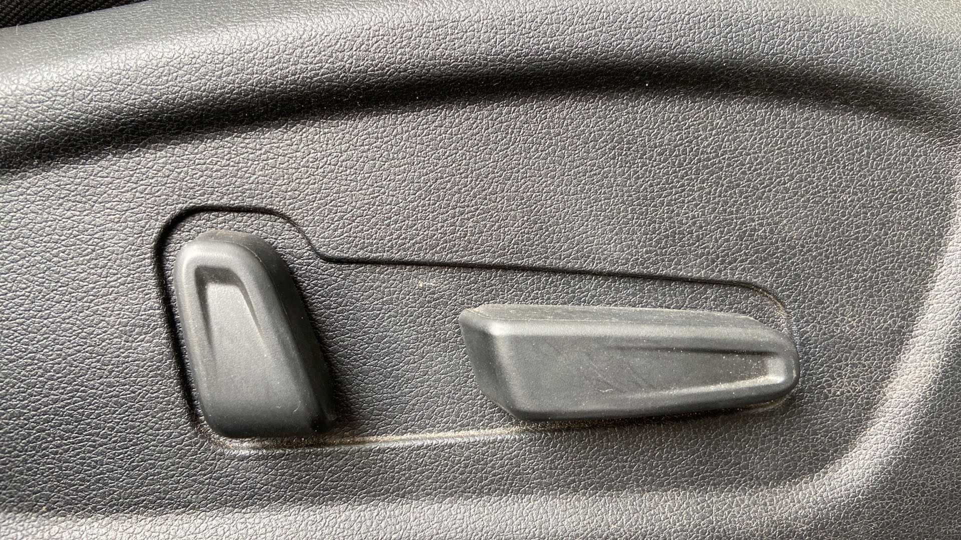 Close-up of seat adjustment controls of a Hyundai Creta 2018-2023