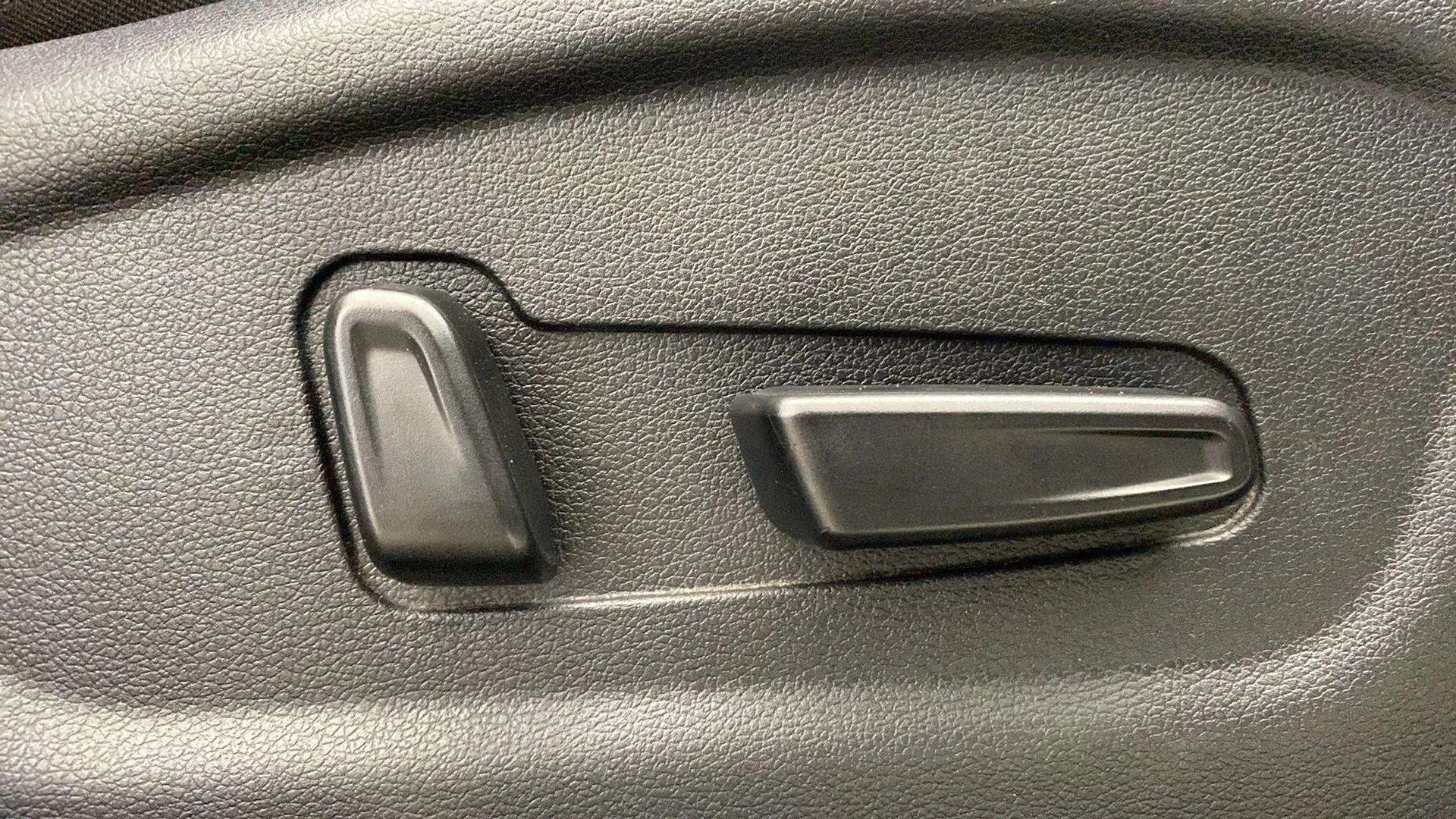 Close-up of a seat adjustment control in a Hyundai Creta 2018-2023