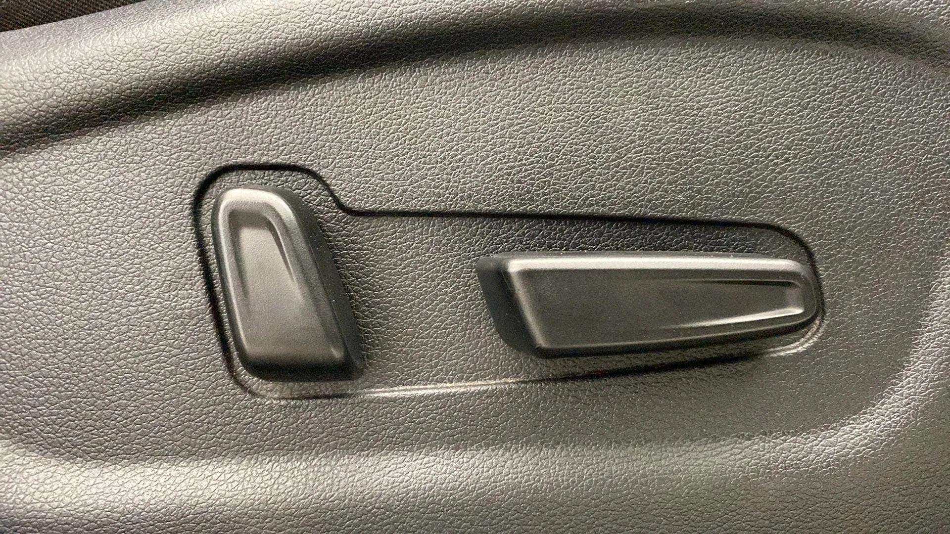 Close-up of a seat adjustment control in a Hyundai Creta 2018-2023