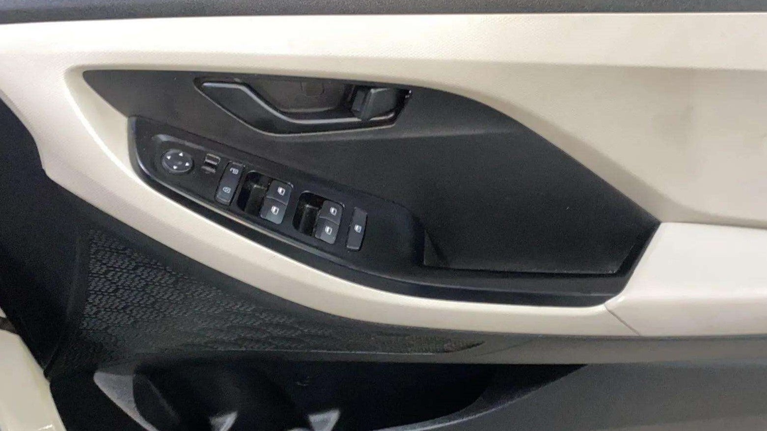 Driver side interior door controls of a Hyundai Creta 2018-2023