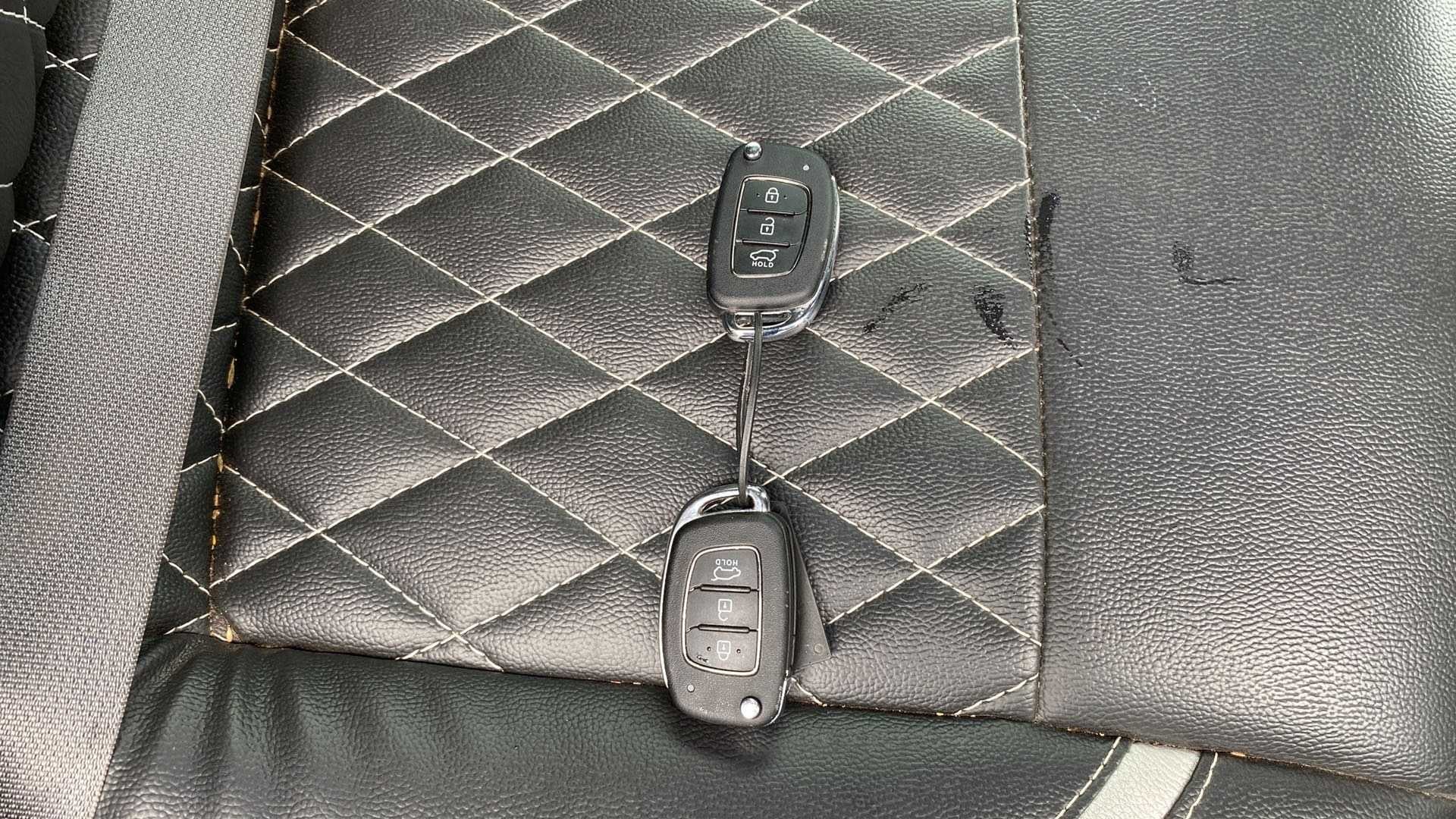 Car key fobs on the seat of a Hyundai Creta