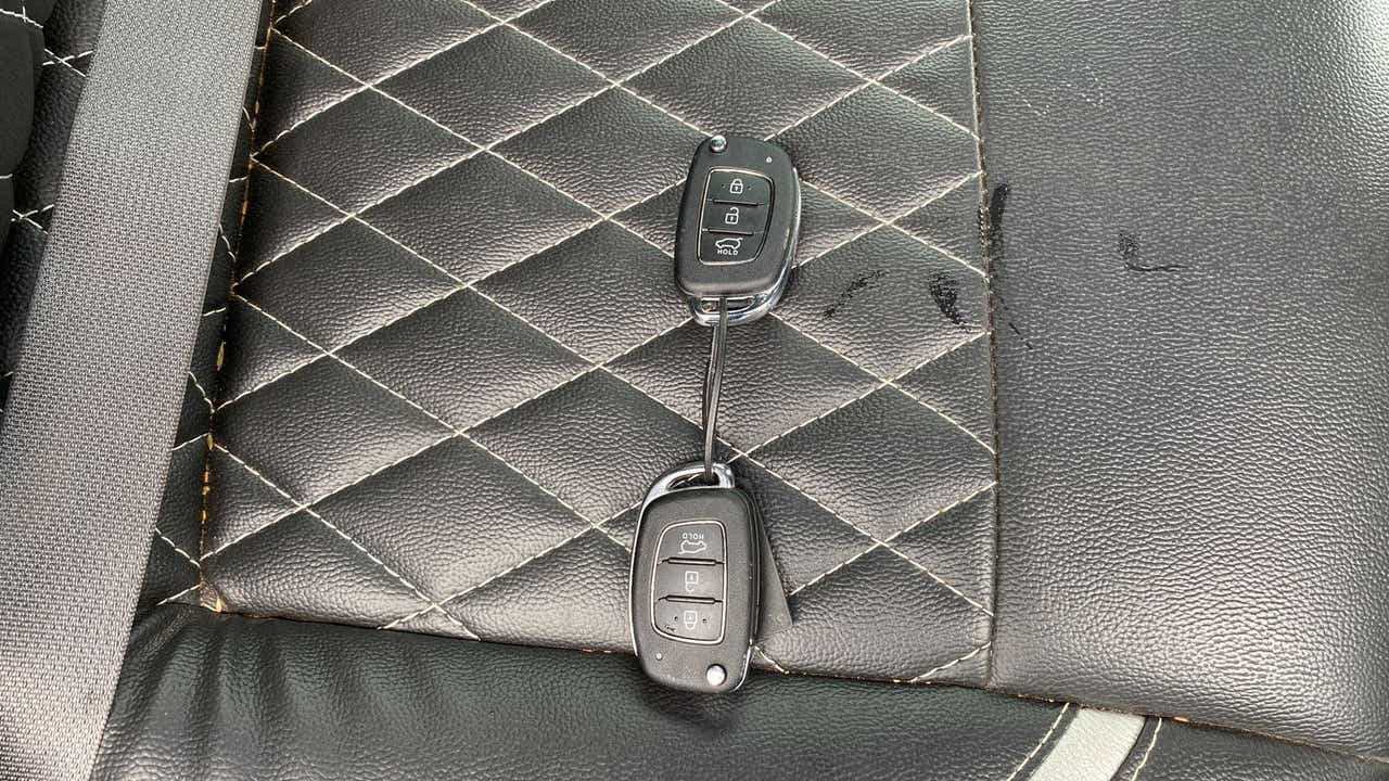 Car key fobs on the seat of a Hyundai Creta