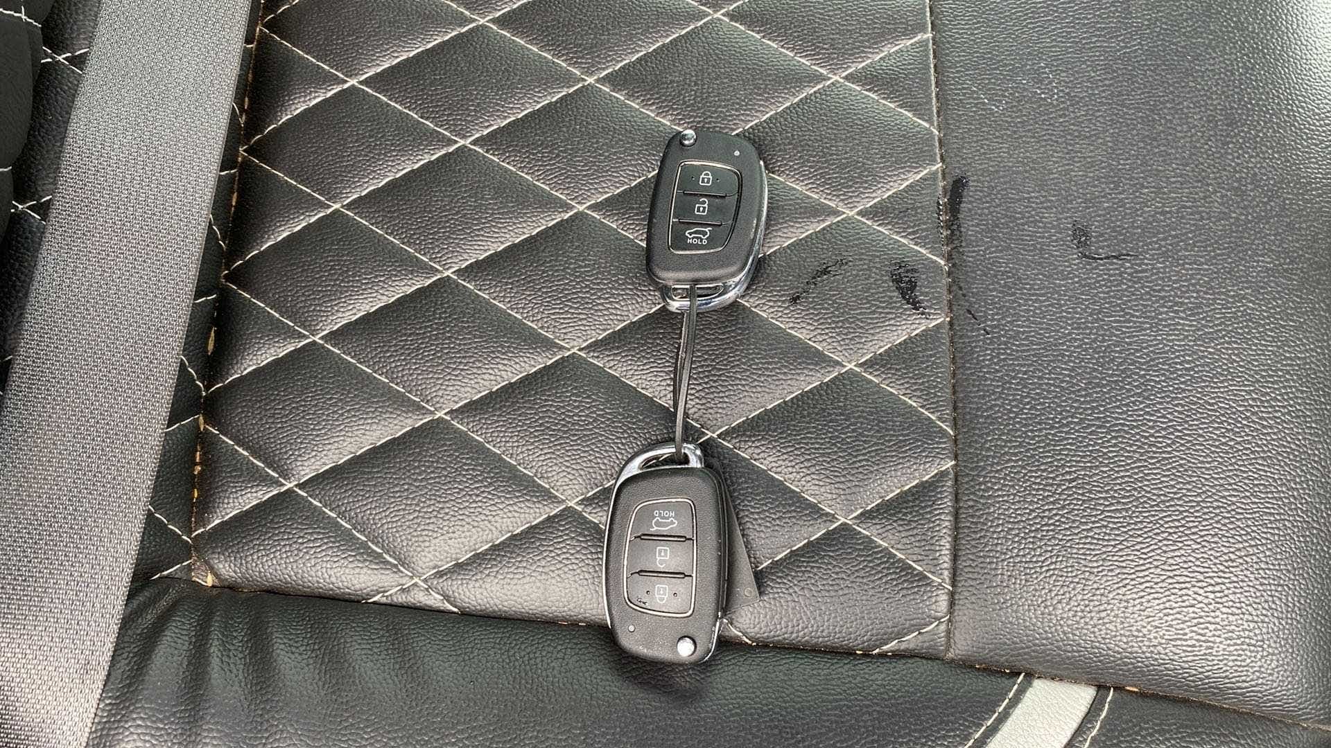 Car key fobs on the seat of a Hyundai Creta