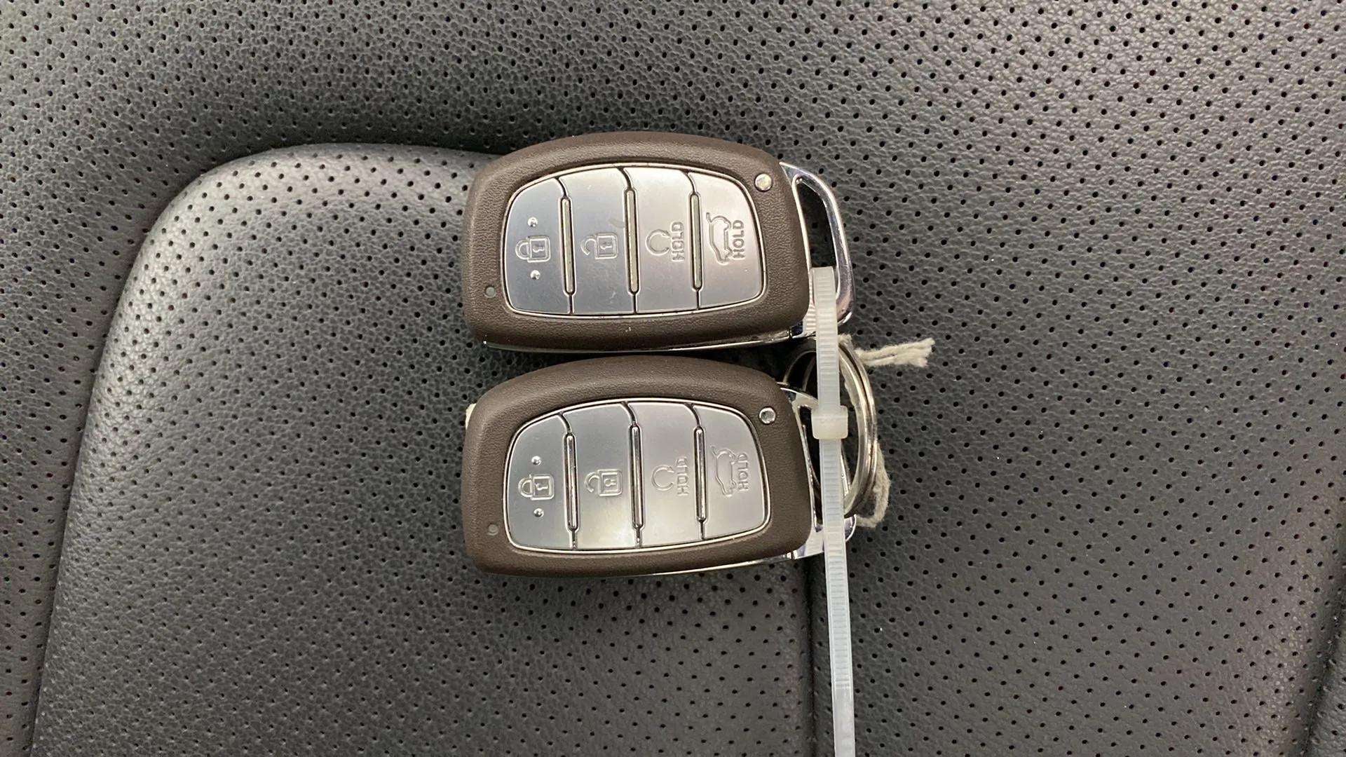 Car key fobs on the seat of a Hyundai Creta 2018-2023