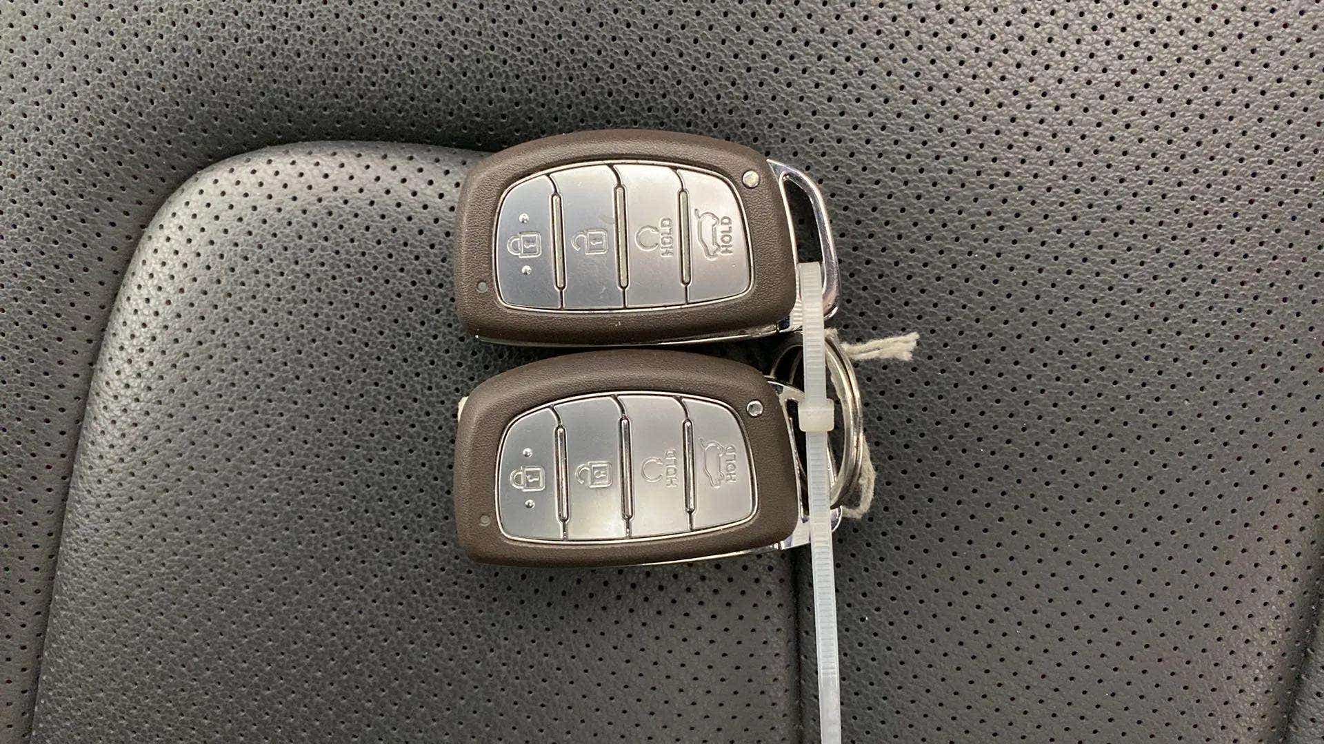 Car key fobs on the seat of a Hyundai Creta 2018-2023