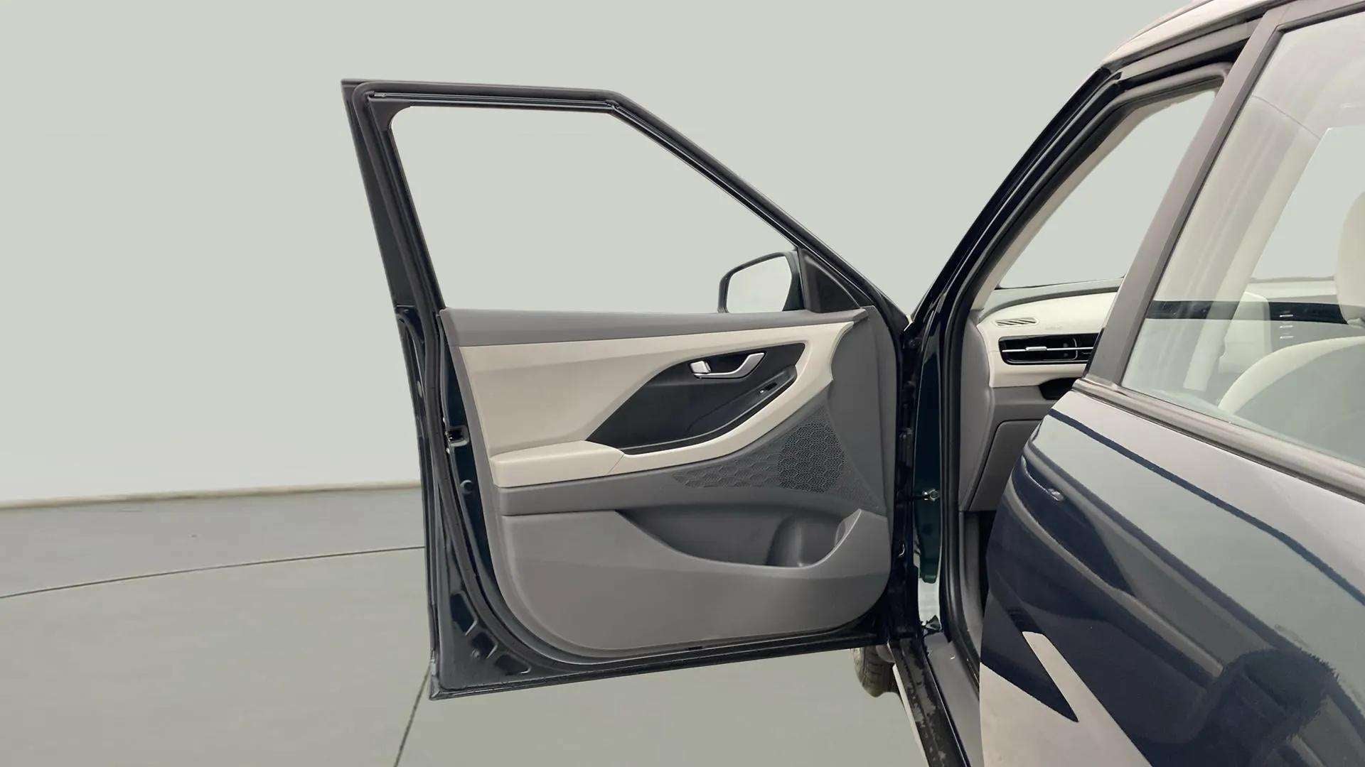 Open front driver-side door of a Hyundai Creta