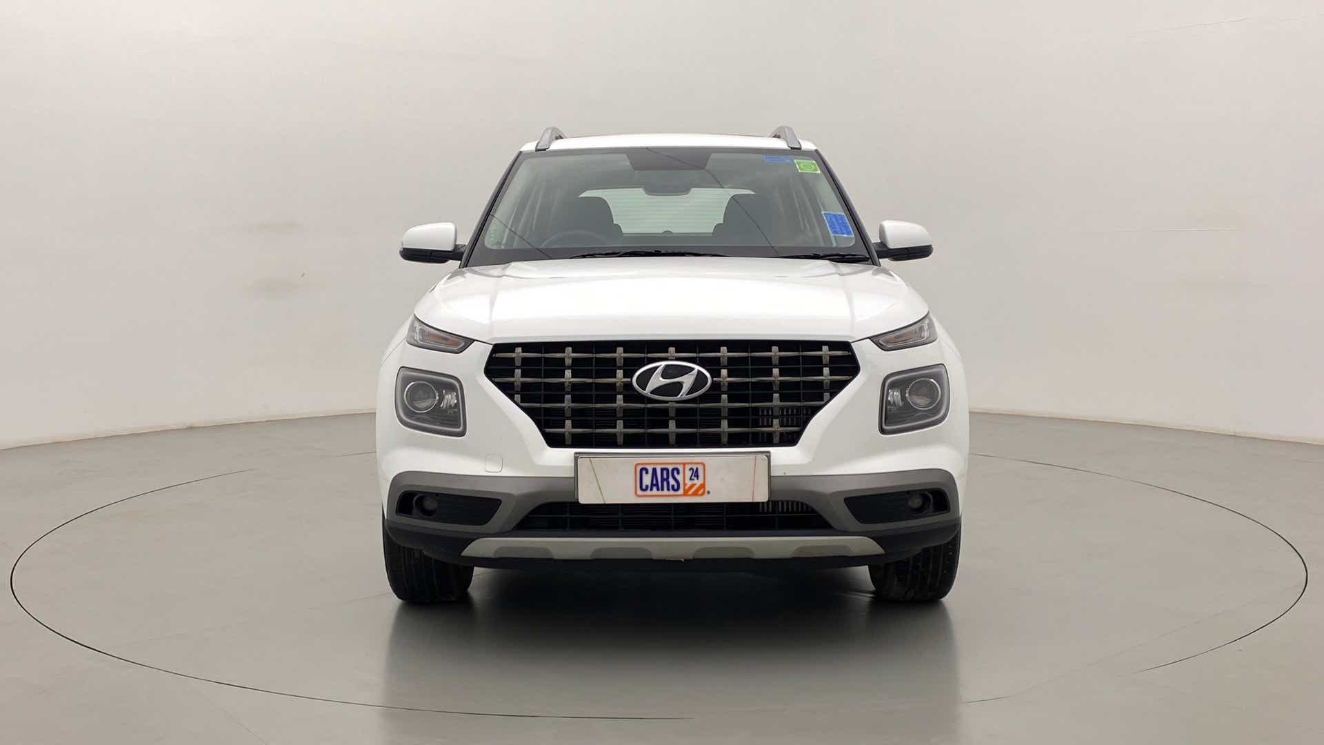 Front view of a Atlas White Hyundai Venue