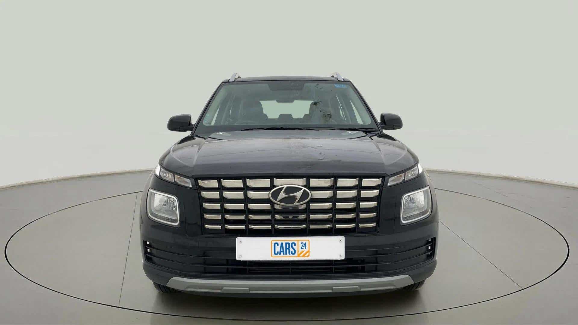 Front view of a abyss black Hyundai Venue