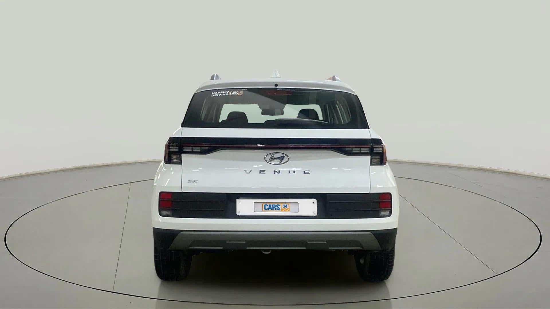 Rear view of a Atlas White Hyundai Venue EX