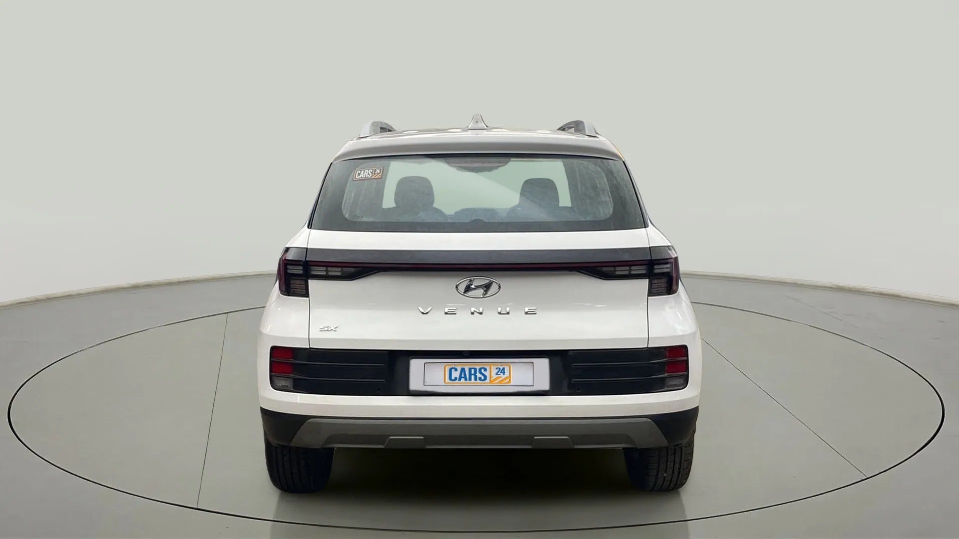 Rear view of a atlas white Hyundai Venue SX
