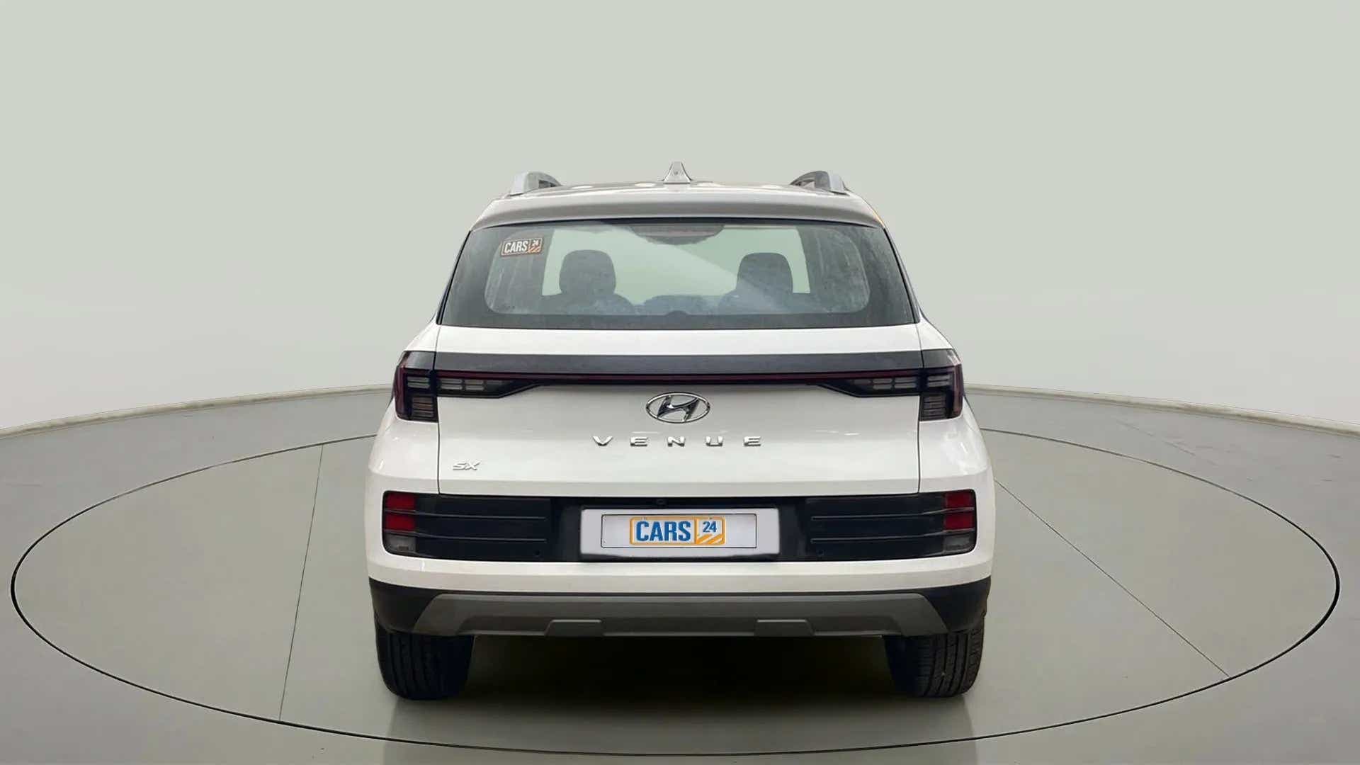 Rear view of a atlas white Hyundai Venue SX