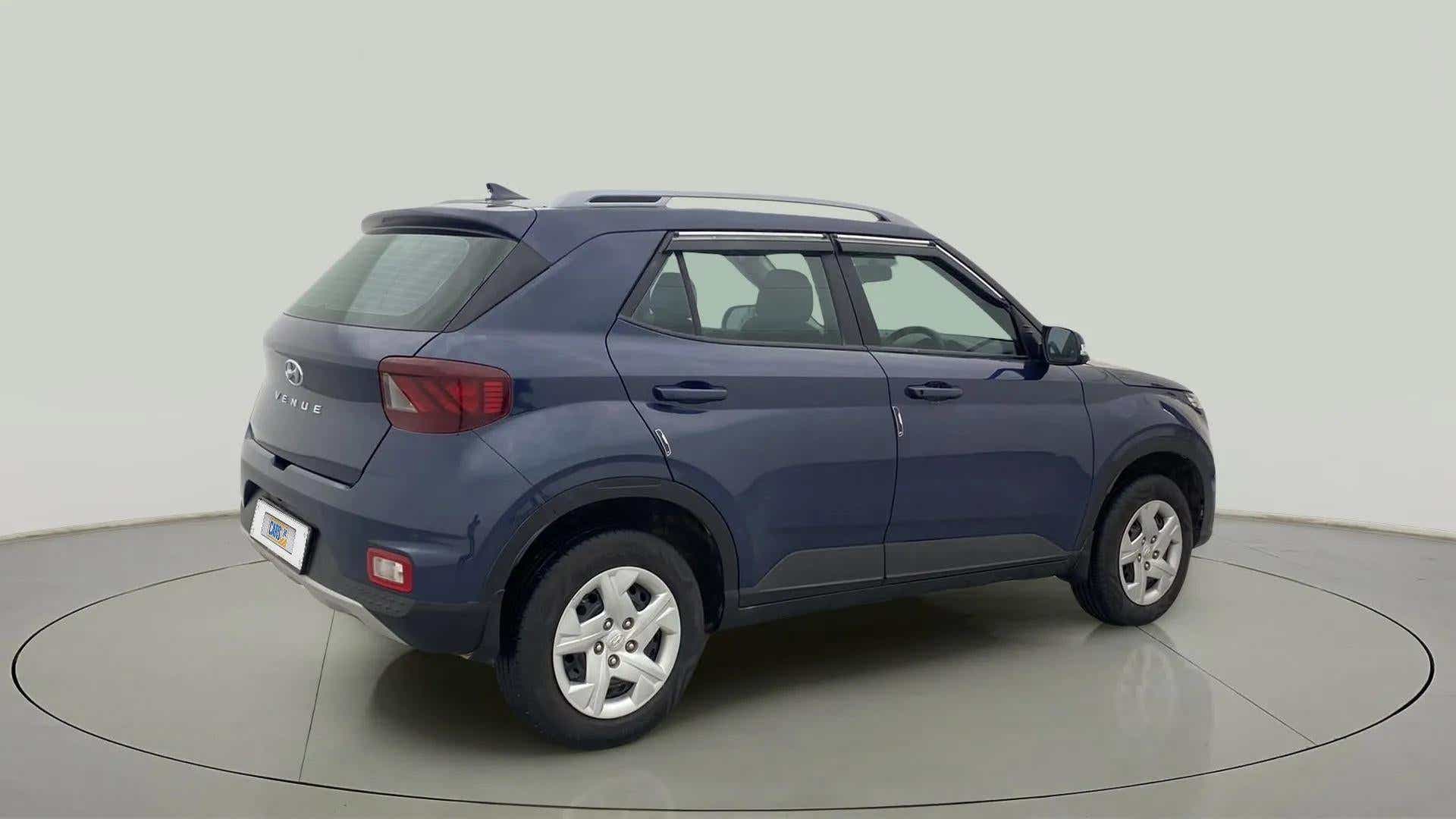 Rear three-quarter view of a Denim Blue Hyundai Venue