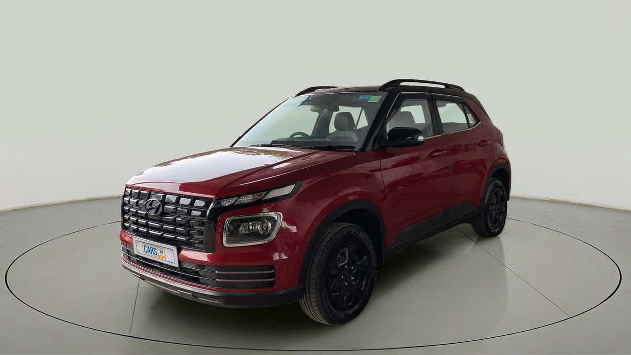 Front three-quarter view of a Fiery Red Hyundai Venue