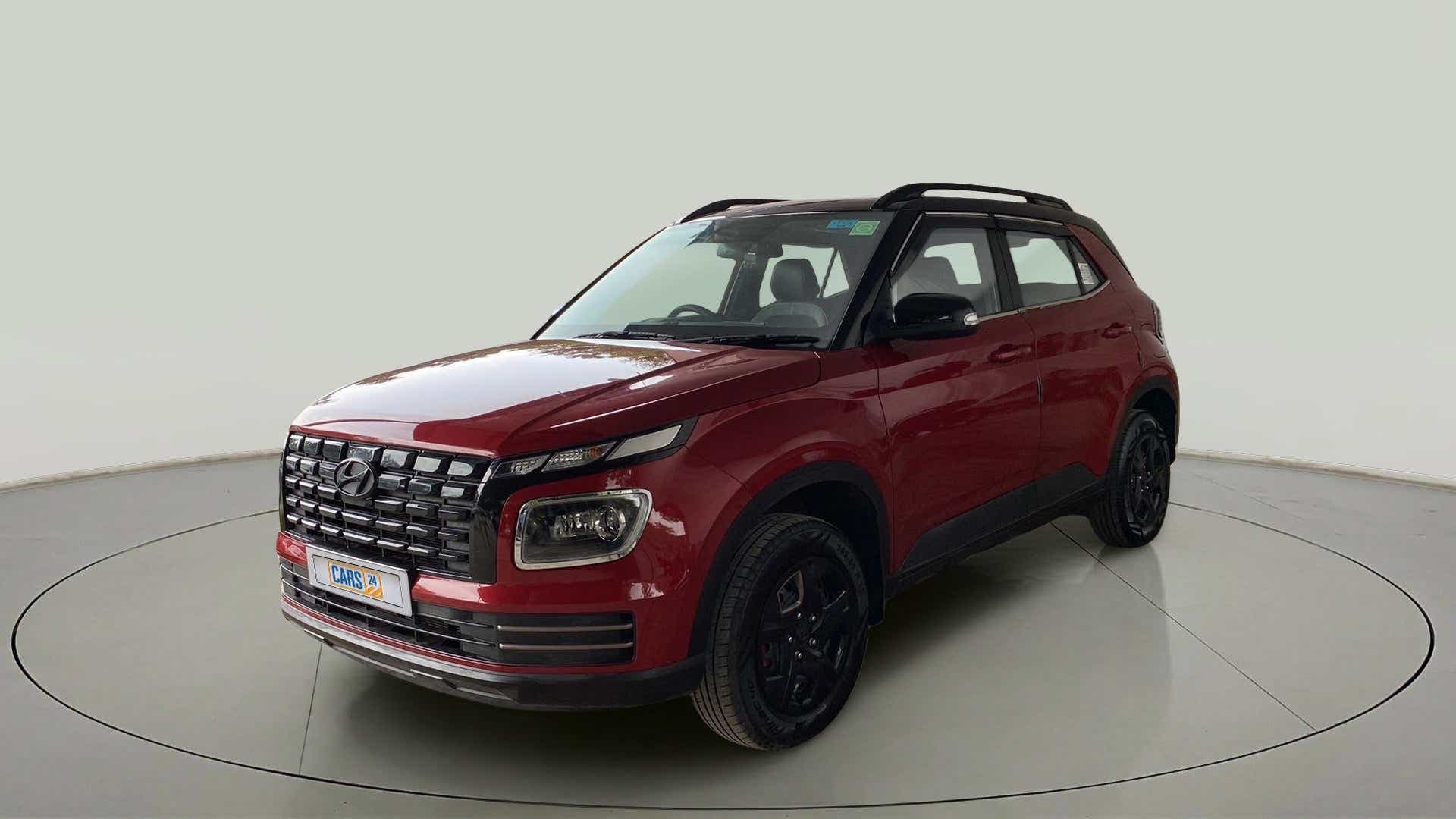 Front three-quarter view of a Fiery Red Hyundai Venue