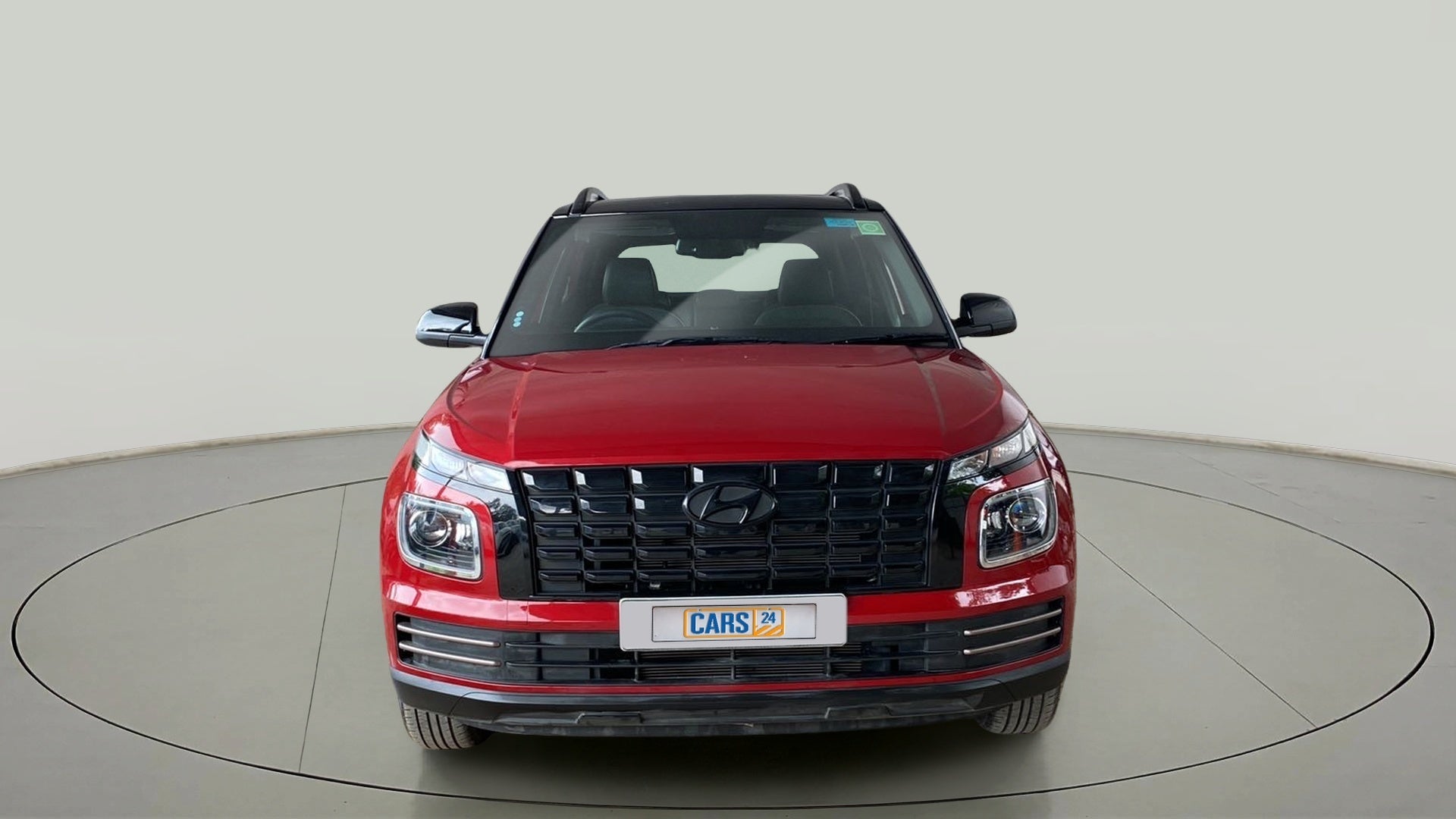 Front view of a Fiery Red Hyundai Venue