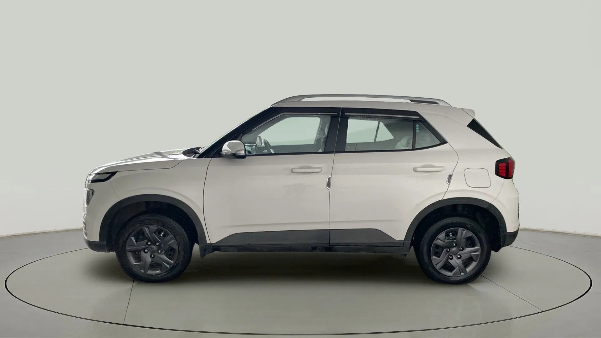 Side view of a Atlas White Hyundai Venue