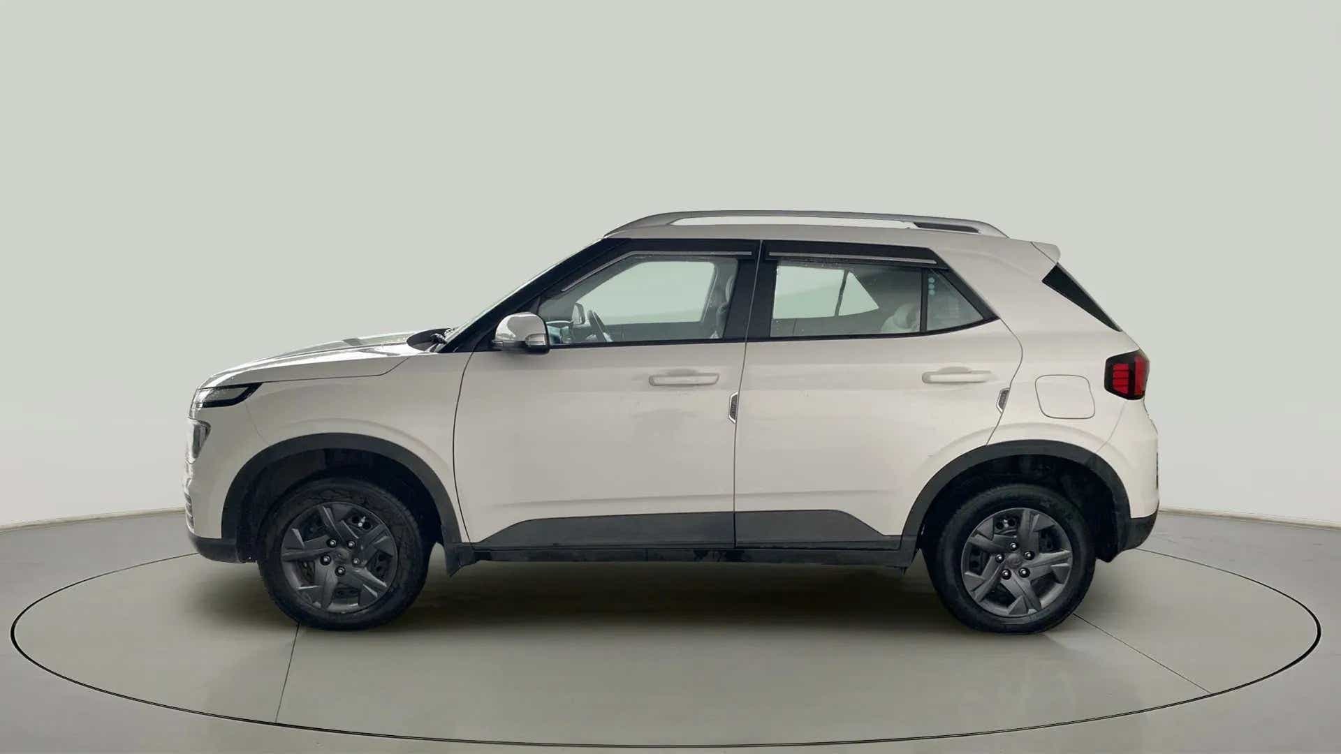 Side view of a Atlas White Hyundai Venue