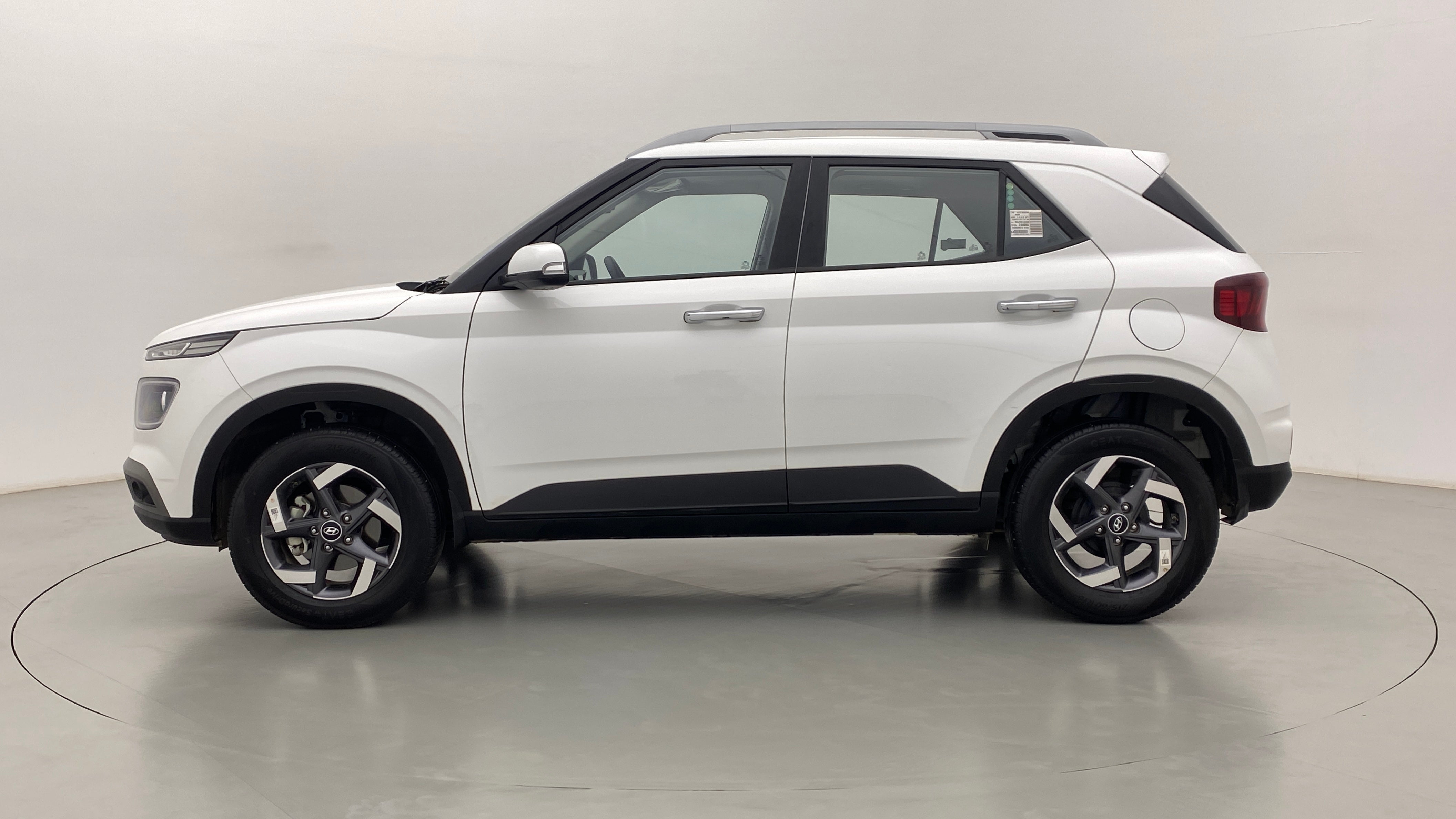 Side profile of a Atlas White Hyundai Venue