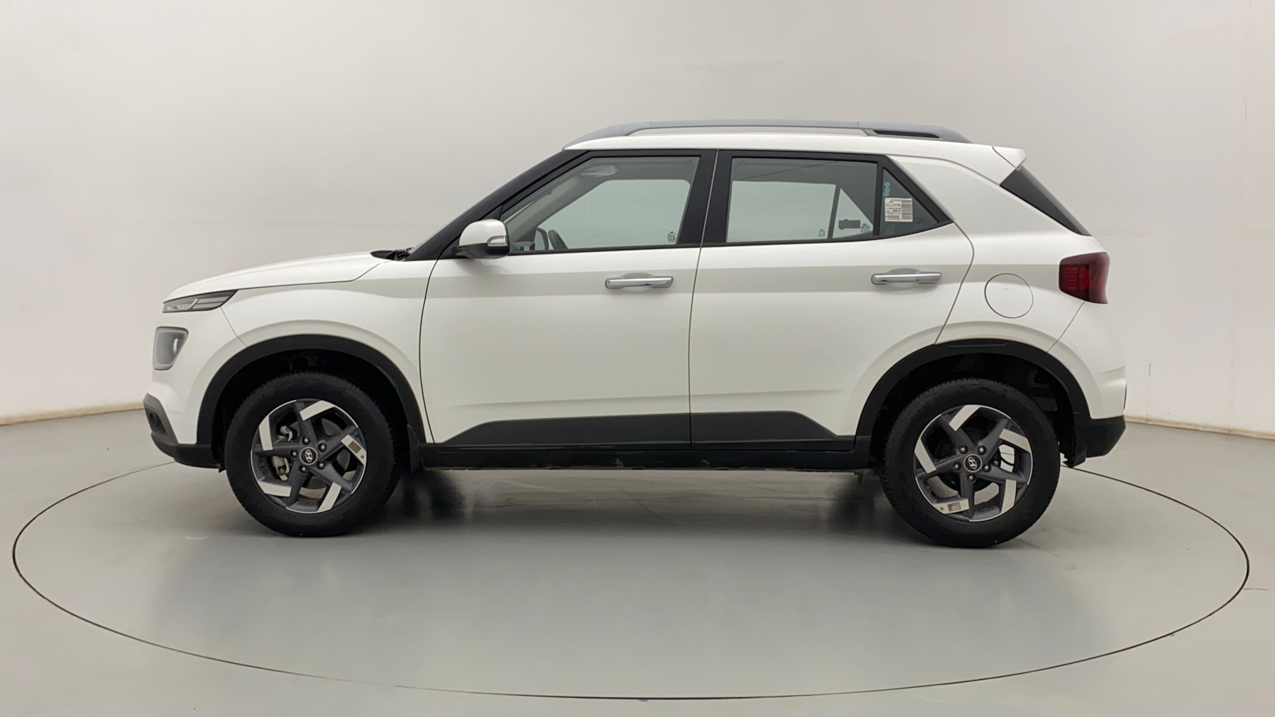 Side view of a Atlas White Hyundai Venue