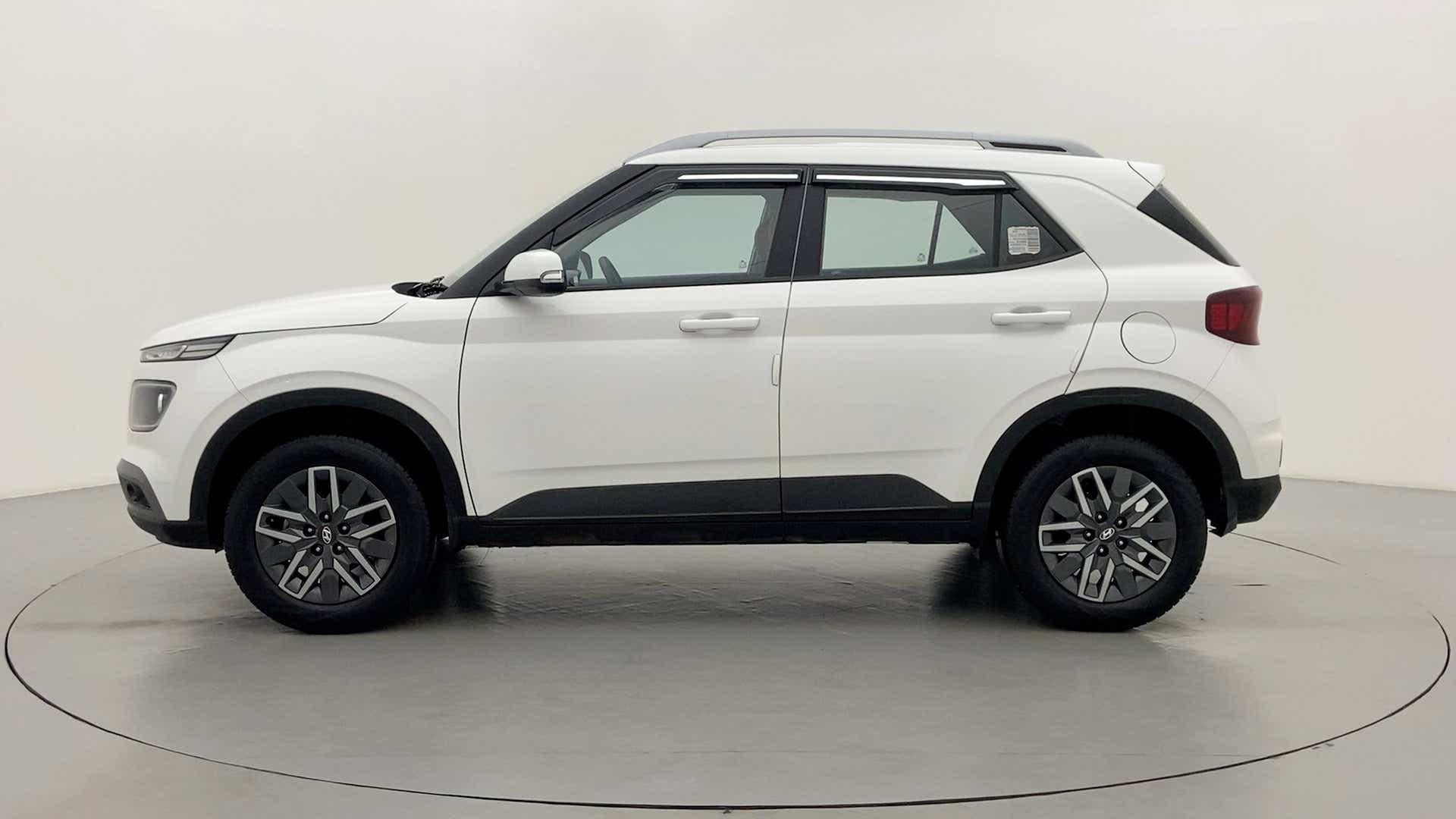 Side view of a Atlas White Hyundai Venue