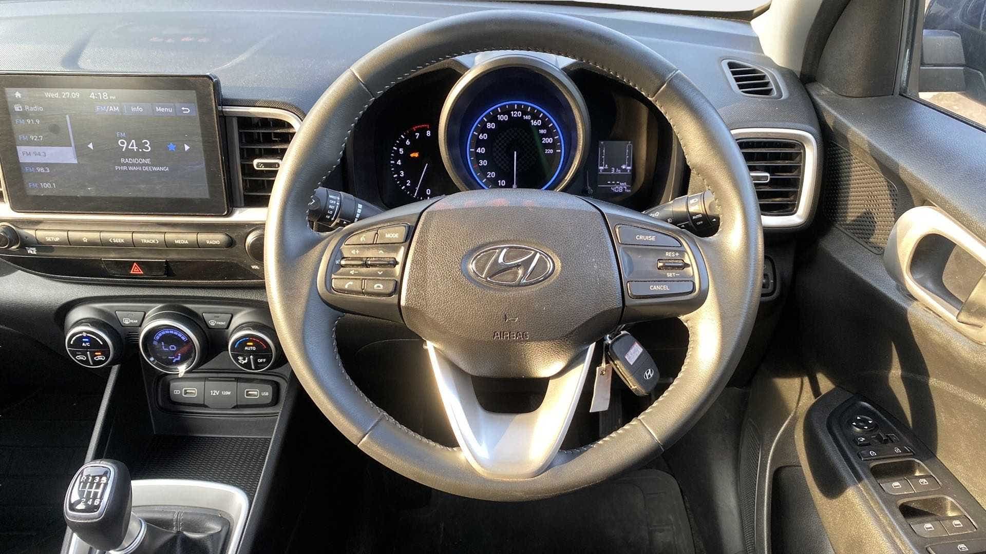 Dashboard and steering wheel view of a Hyundai Venue