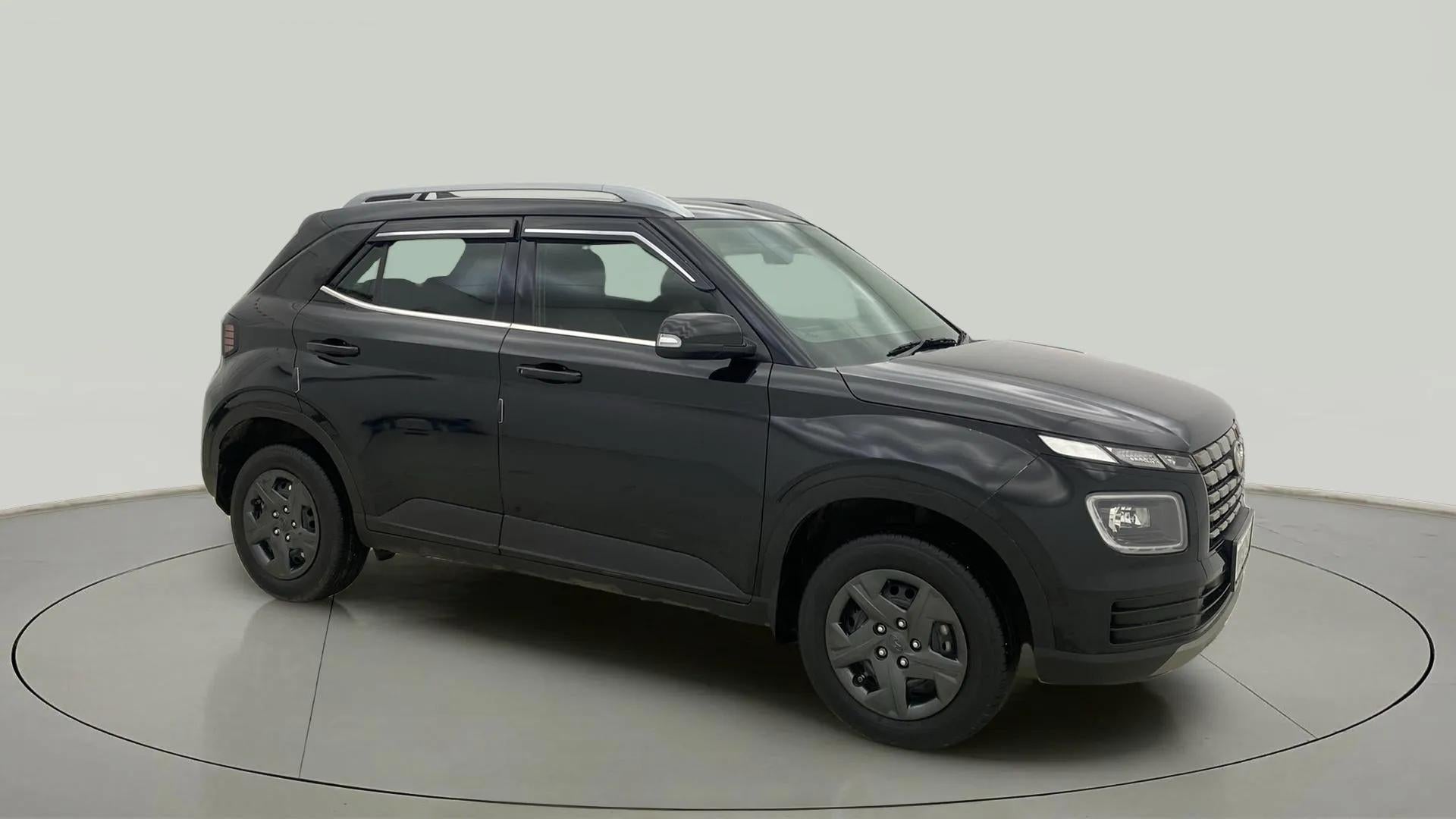 Side view of a abyss black Hyundai Venue