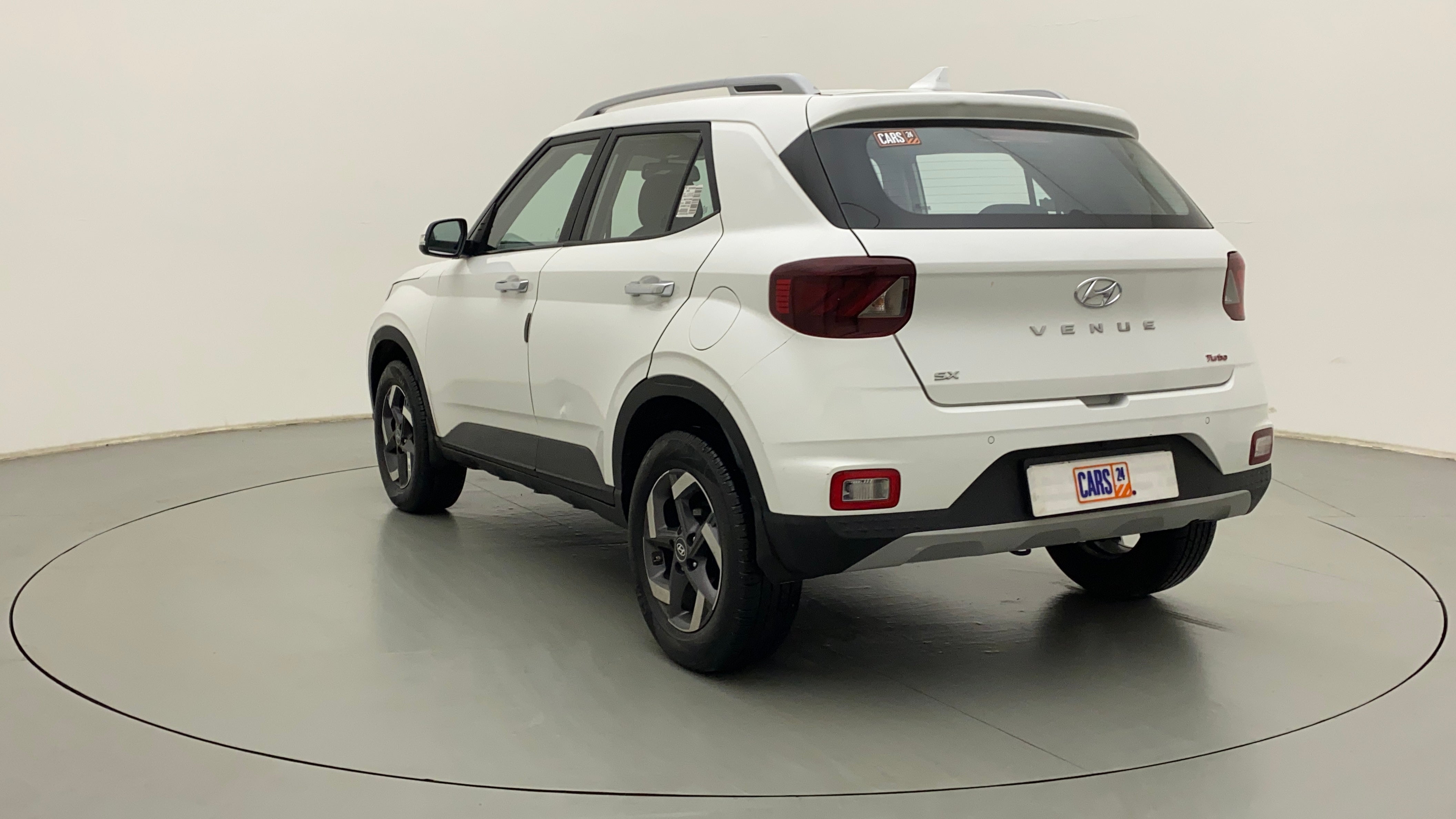 Rear three-quarter view of a Atlas White Hyundai Venue SX Turbo