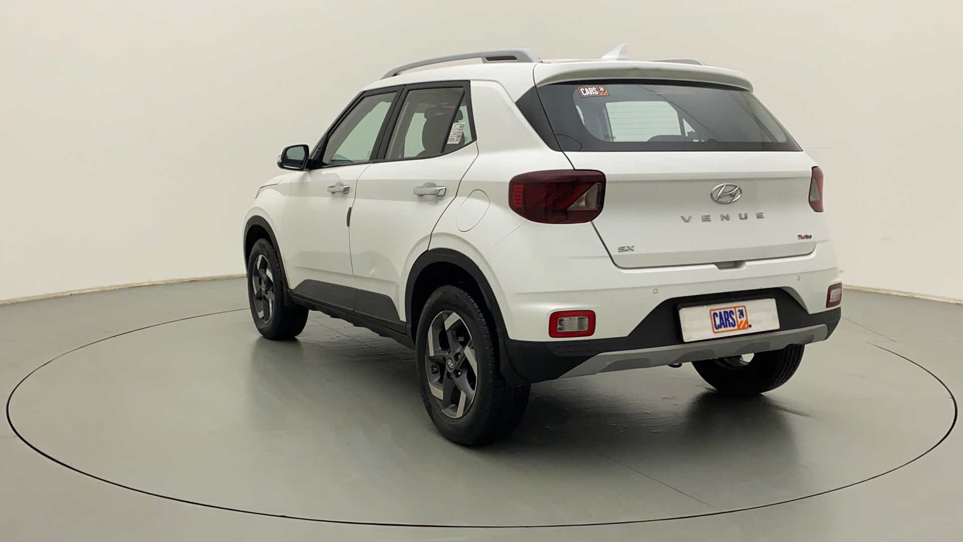 Rear three-quarter view of a Atlas White Hyundai Venue SX Turbo
