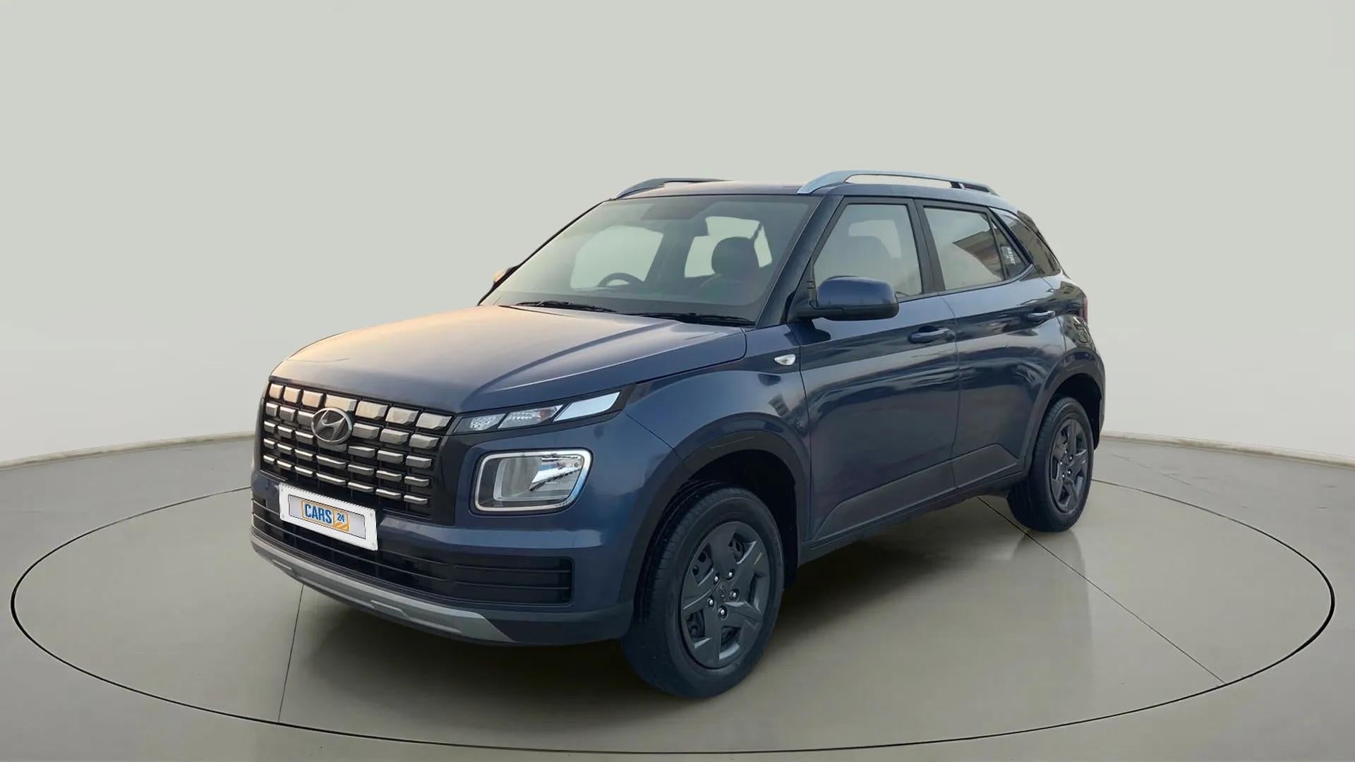 Front three-quarter view of a denim blue Hyundai Venue