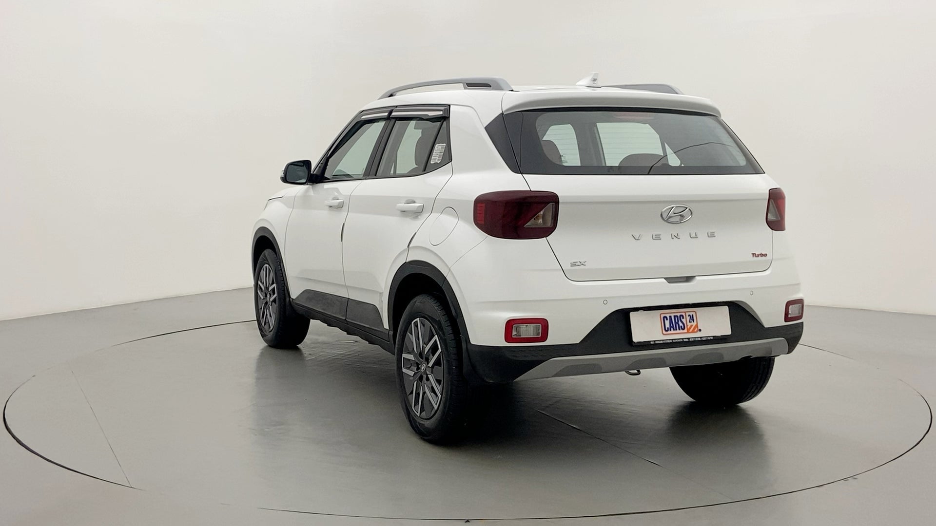 Rear three-quarter of a Atlas White Hyundai Venue SX Turbo